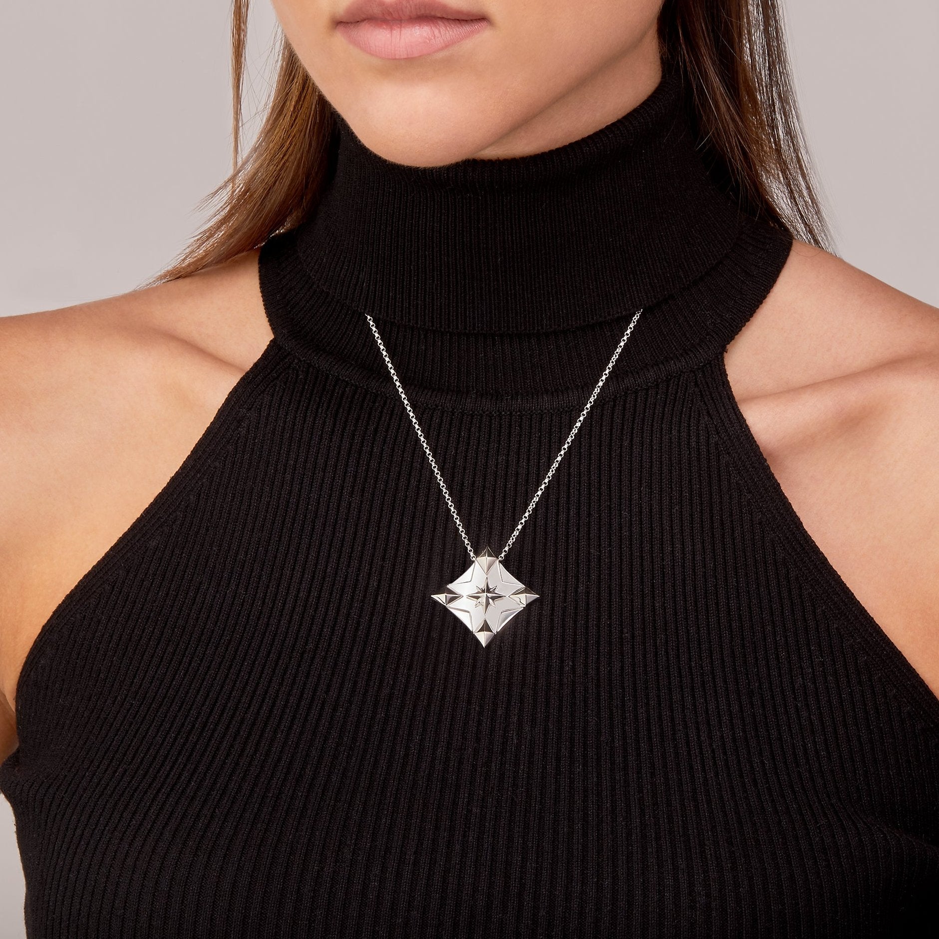 2025 Trust Your Inner Compass Lucky Charm displayed on model