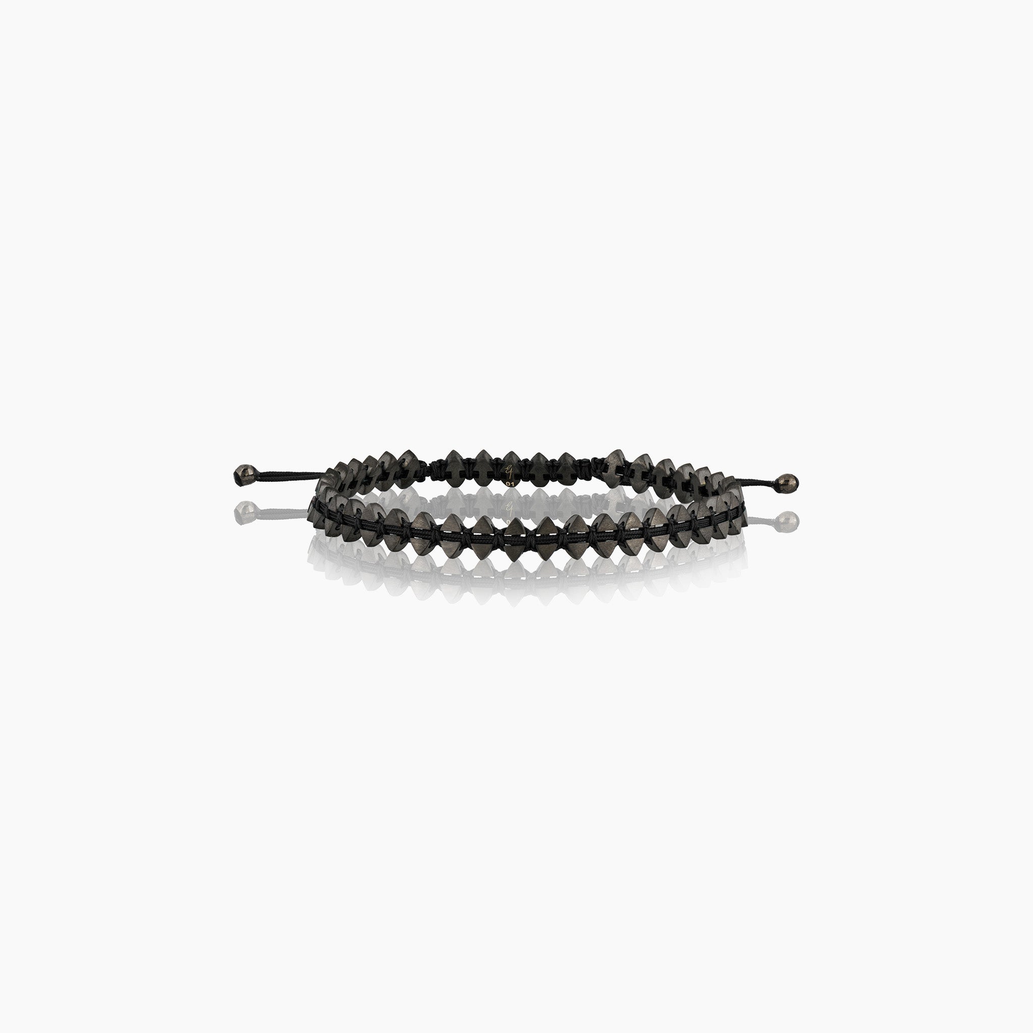 Men's dual-sided anchor bracelet with anchor and boat-inspired triangle motifs, showcased against an off-white background.