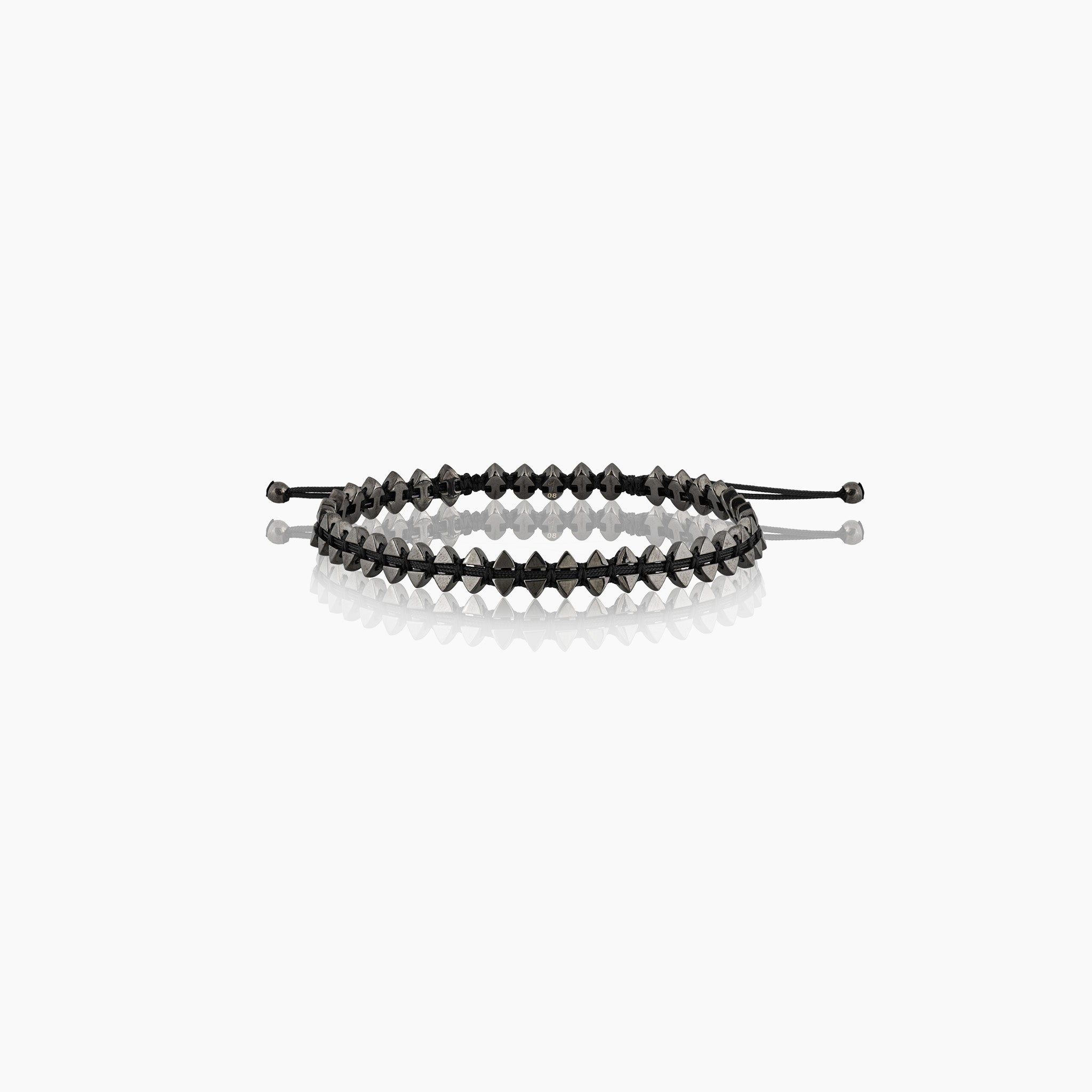 Men's dual-sided anchor bracelet with anchor and boat-inspired triangle motifs, showcased against an off-white background.