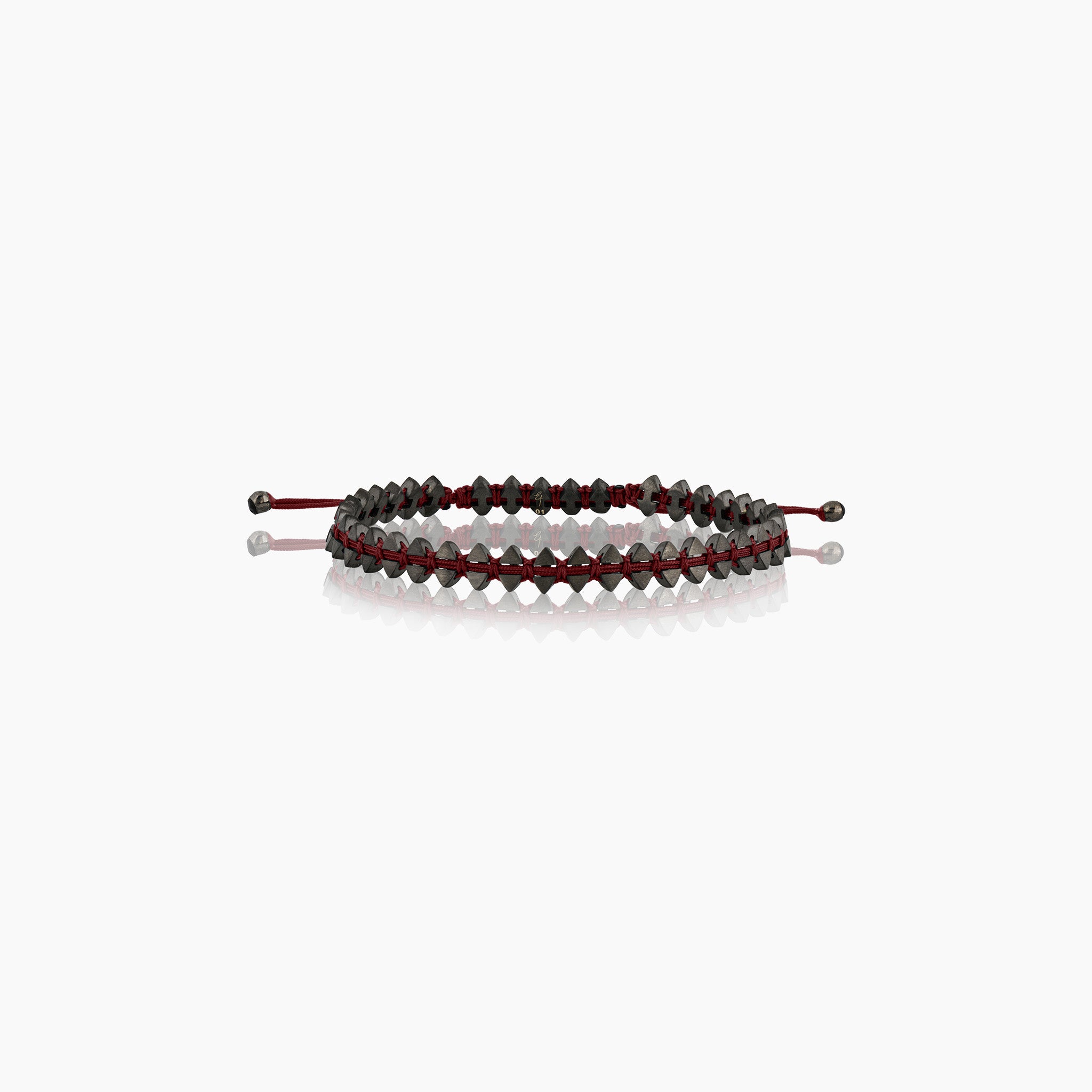 Men's dual-sided anchor bracelet with anchor and boat-inspired triangle motifs, showcased against an off-white background.