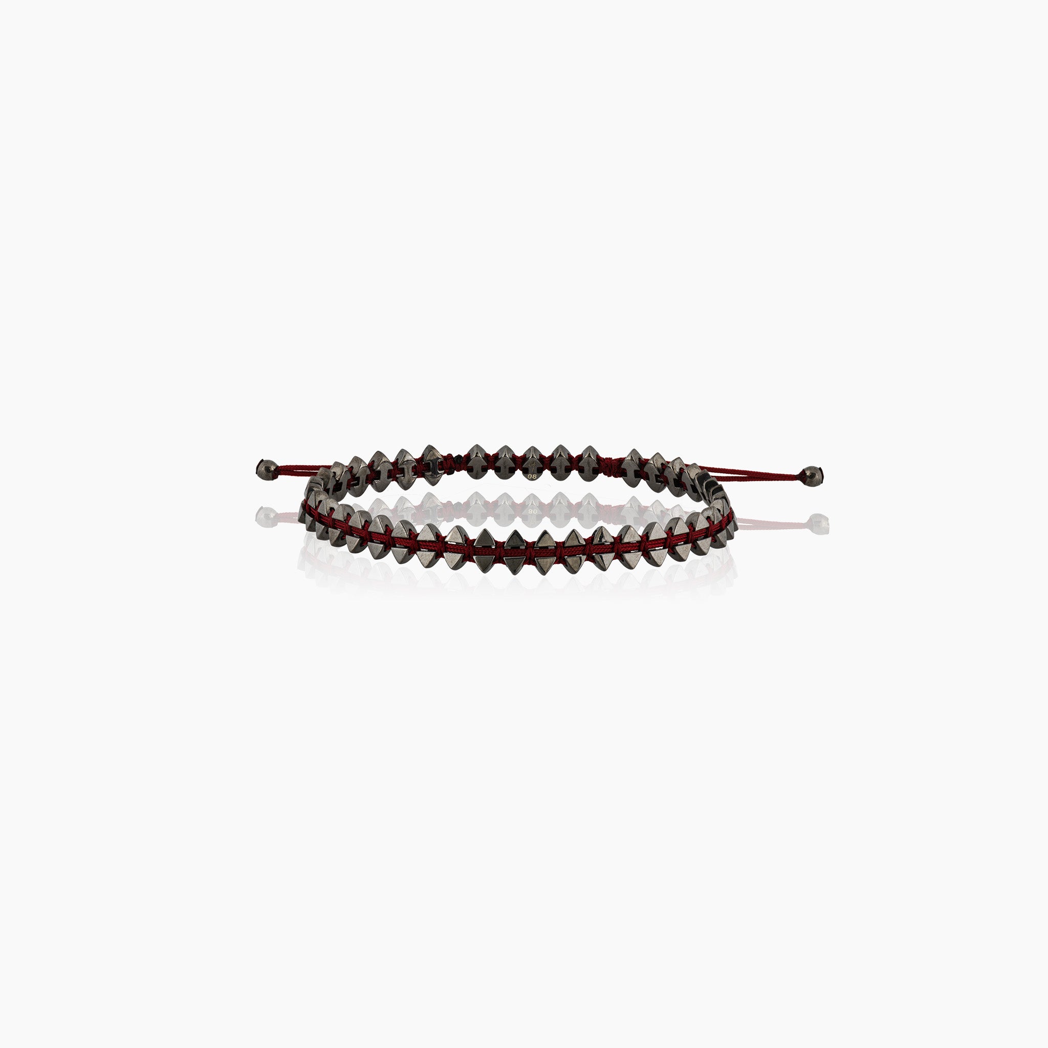 Men's dual-sided anchor bracelet with anchor and boat-inspired triangle motifs, showcased against an off-white background.