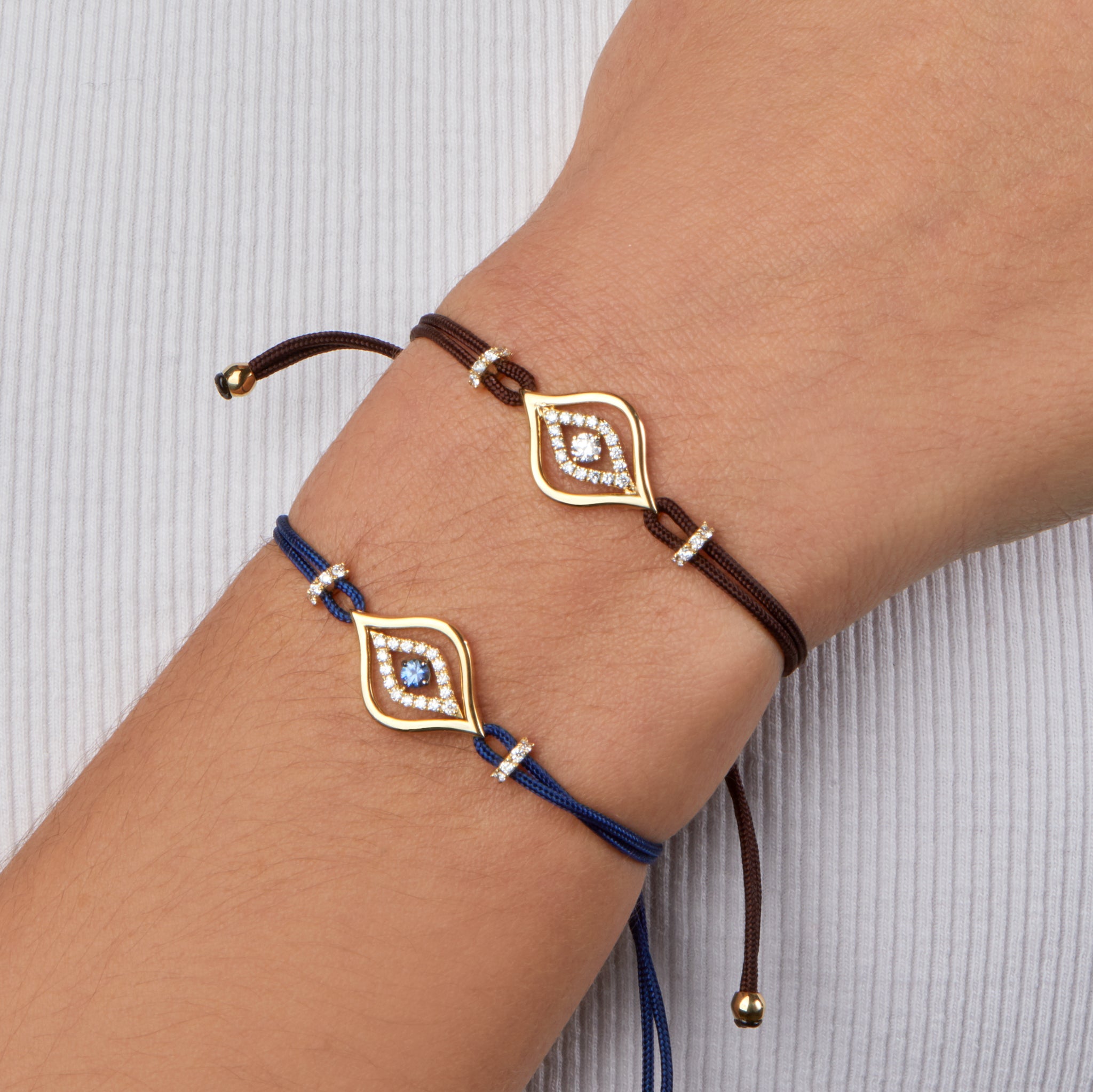 Evil Eye Bracelets displayed on model.