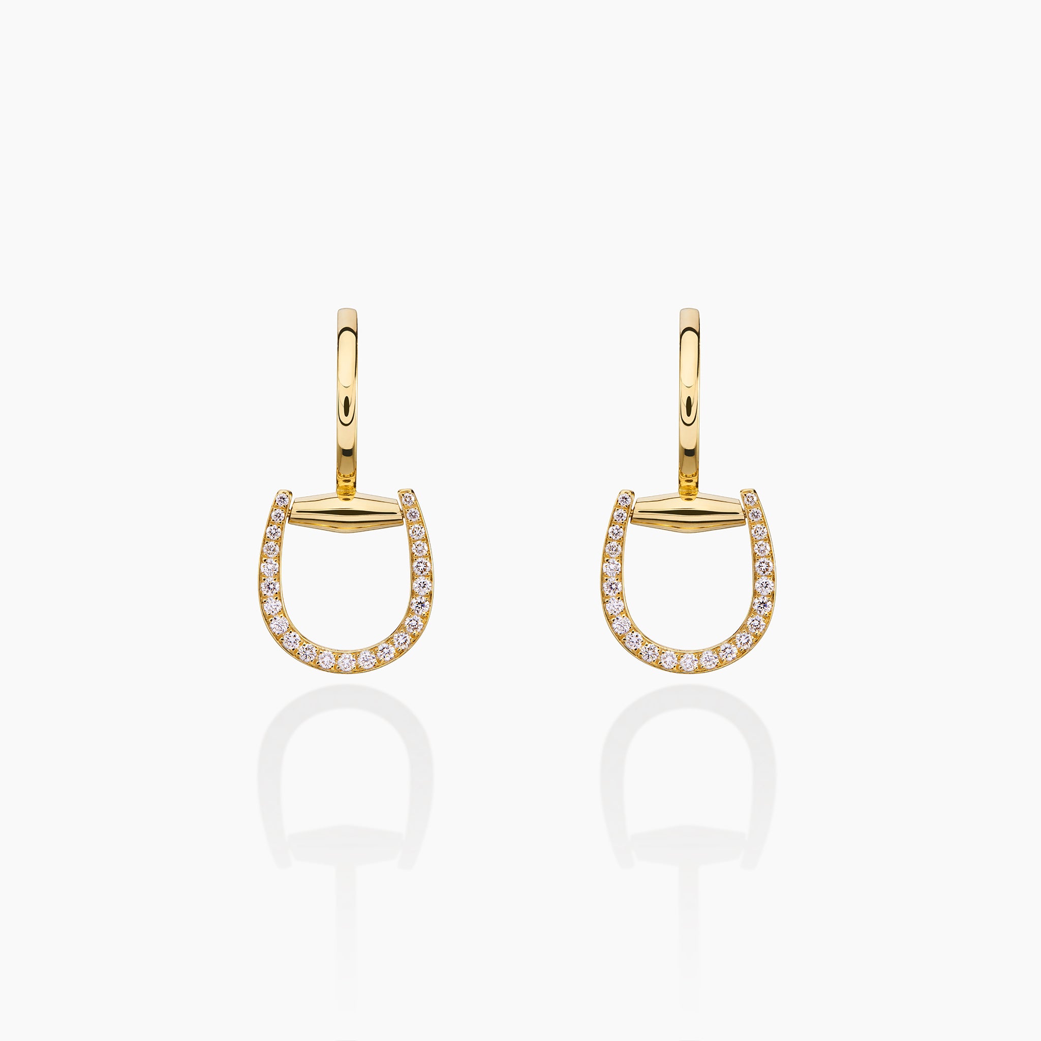 Convertible Horsebit Hoop Earrings displayed against off white background