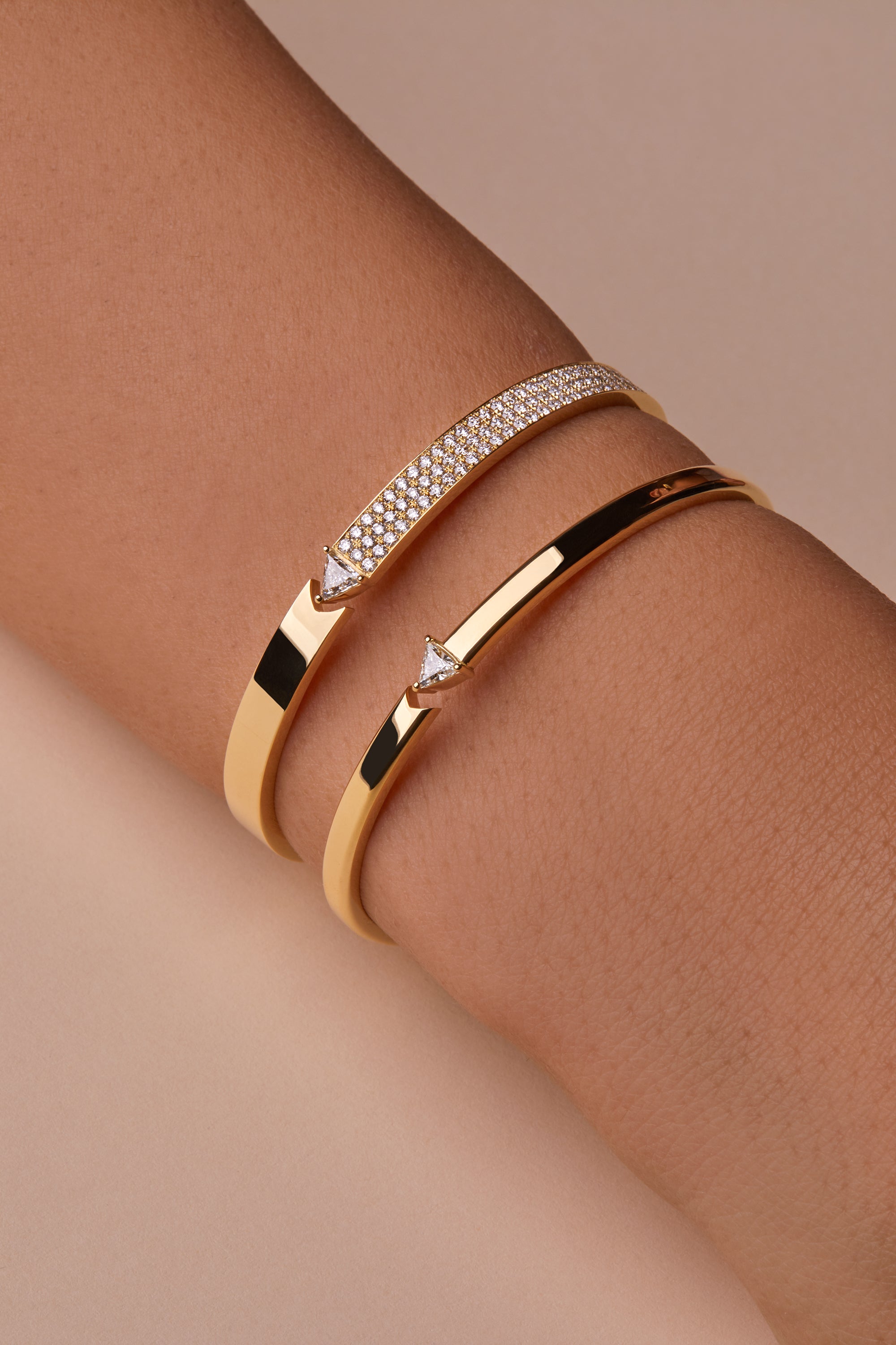 Two stellar stand still bangles portrayed on hand model.