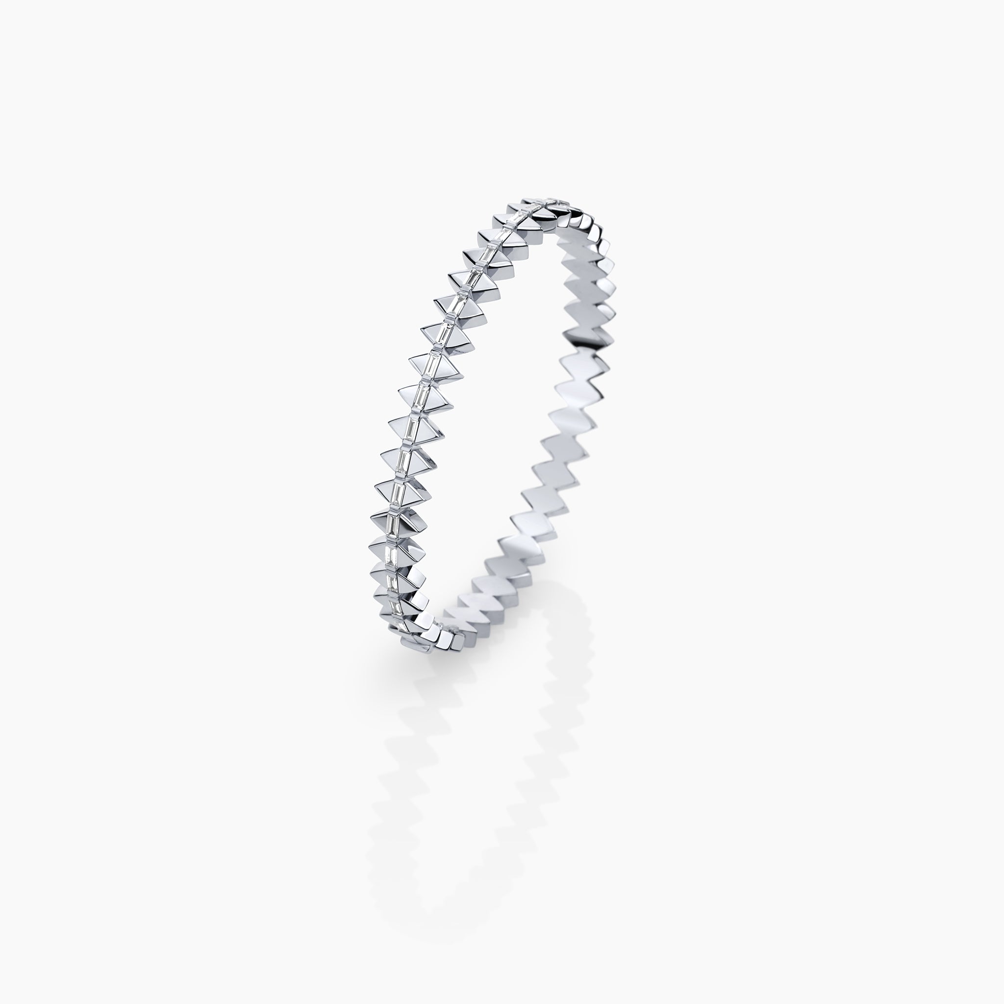 Solidarity Bangle in White Gold inspired by the anchor bracelet displayed on an off white background