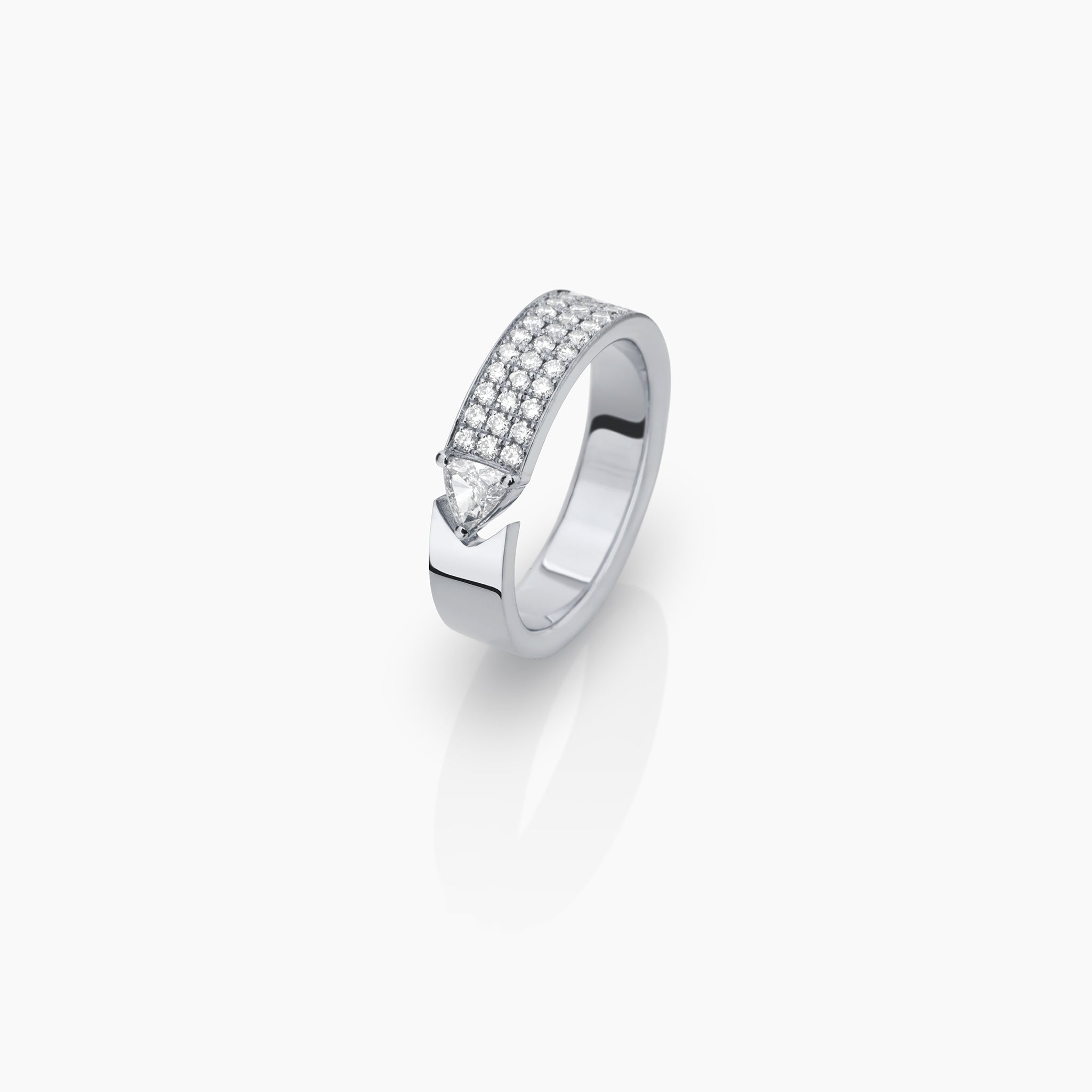 Stellar Standstill ring in white gold featuring diamonds displayed on off white background.