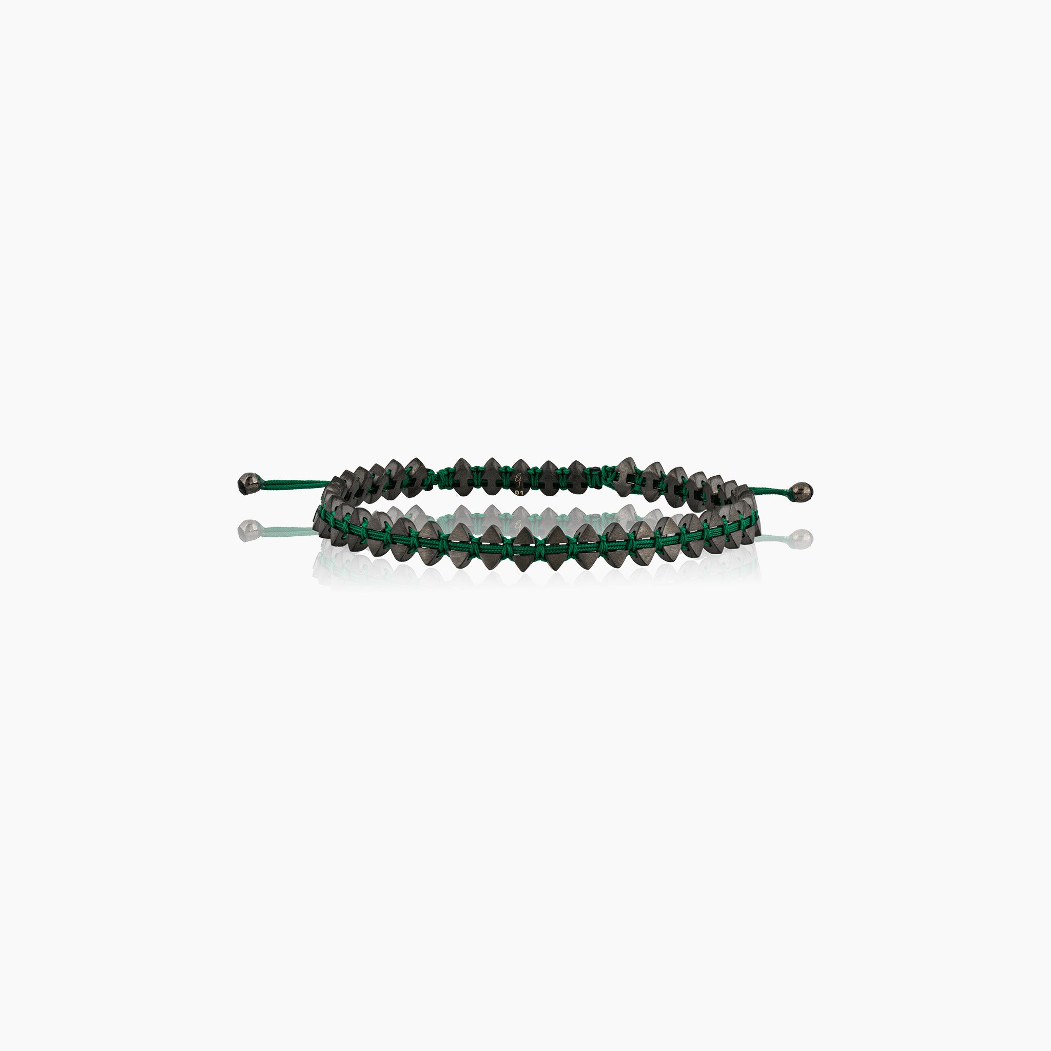 Men's dual-sided anchor bracelet with anchor and boat-inspired triangle motifs, showcased against an off-white background.