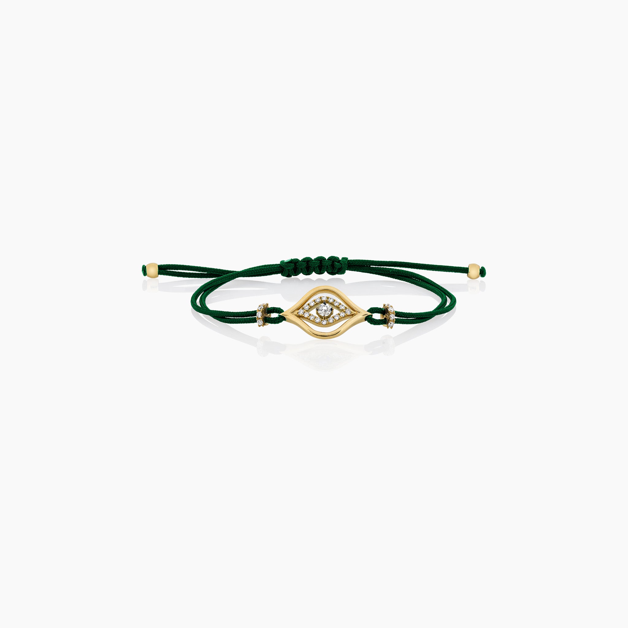 A stylish evil eye cord bracelet featuring diamonds, set on a cord, presented against an off-white background.