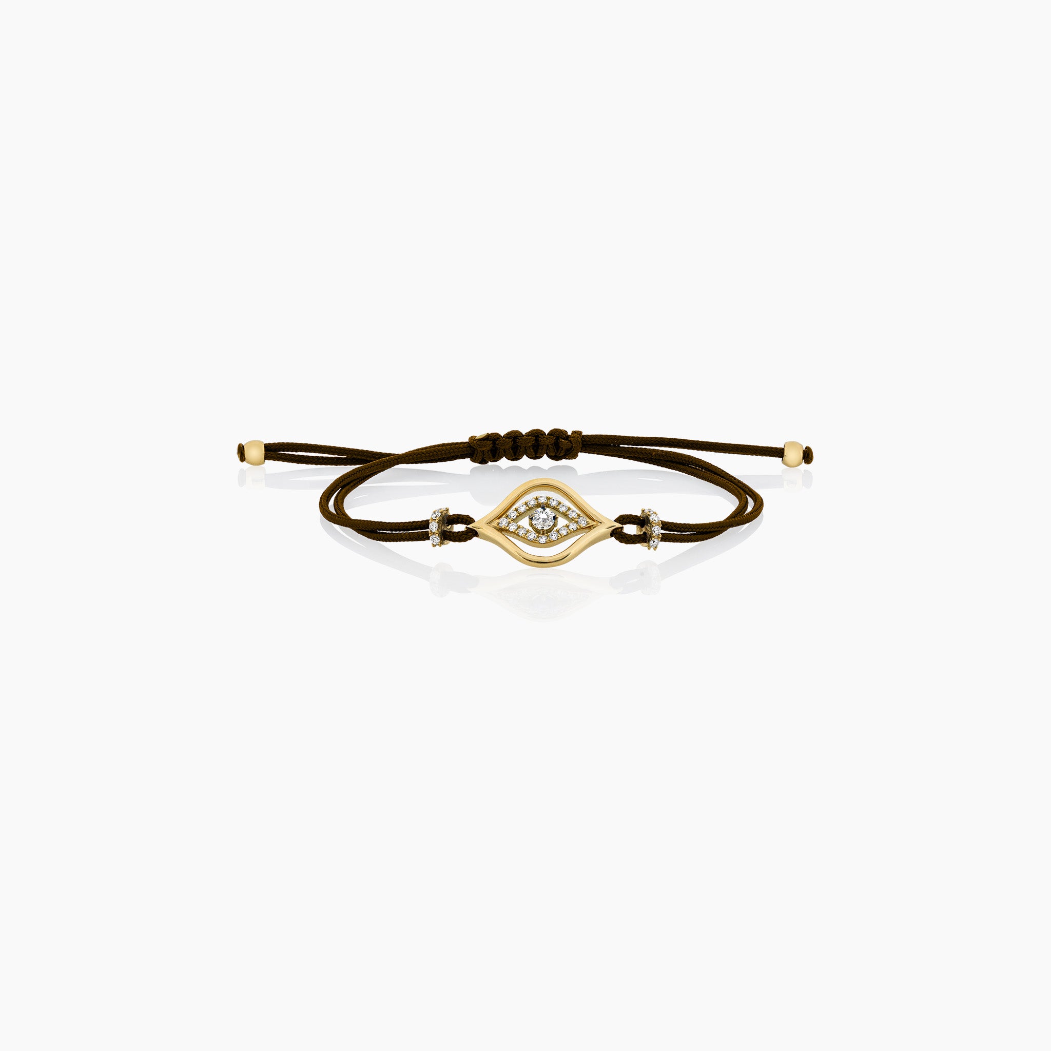 A stylish evil eye cord bracelet featuring diamonds, set on a cord, presented against an off-white background.
