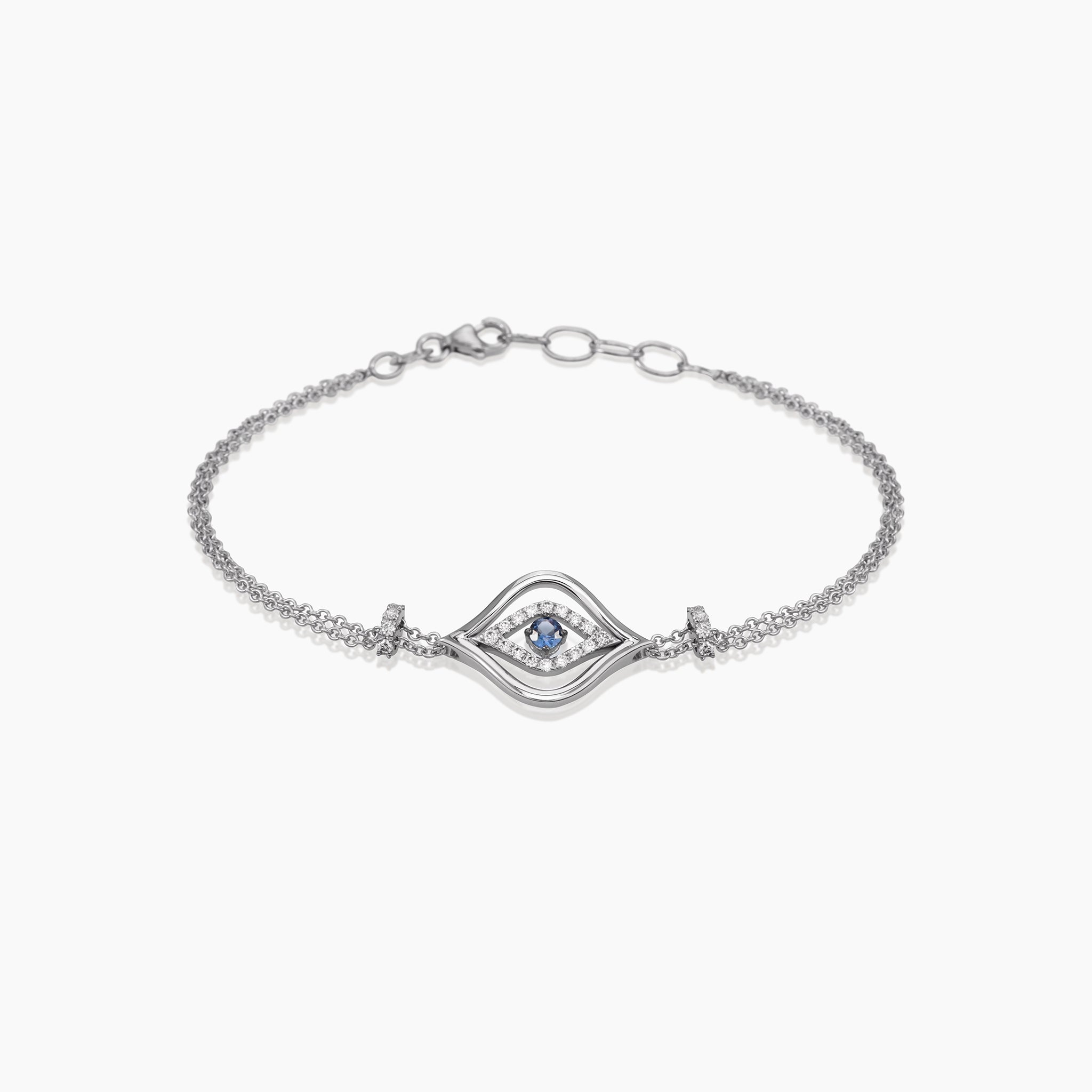 Evil Eye Sapphire Chain Bracelet displayed against an off white background