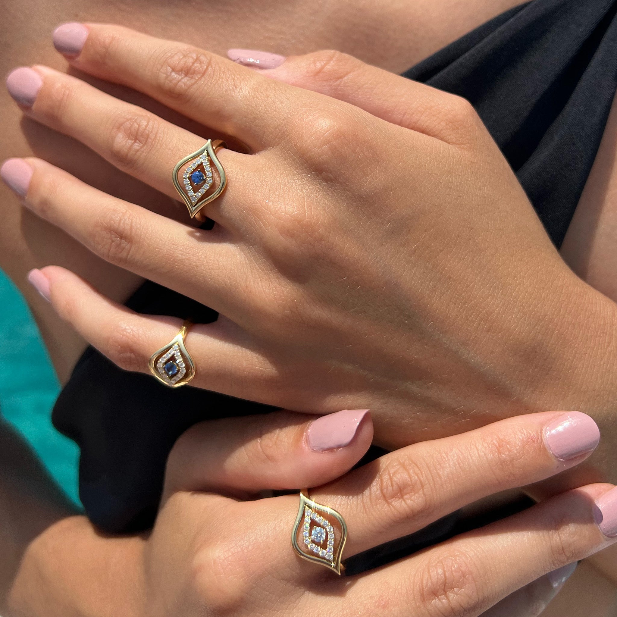 Evil Eye rings elegantly showcased on a hand model.