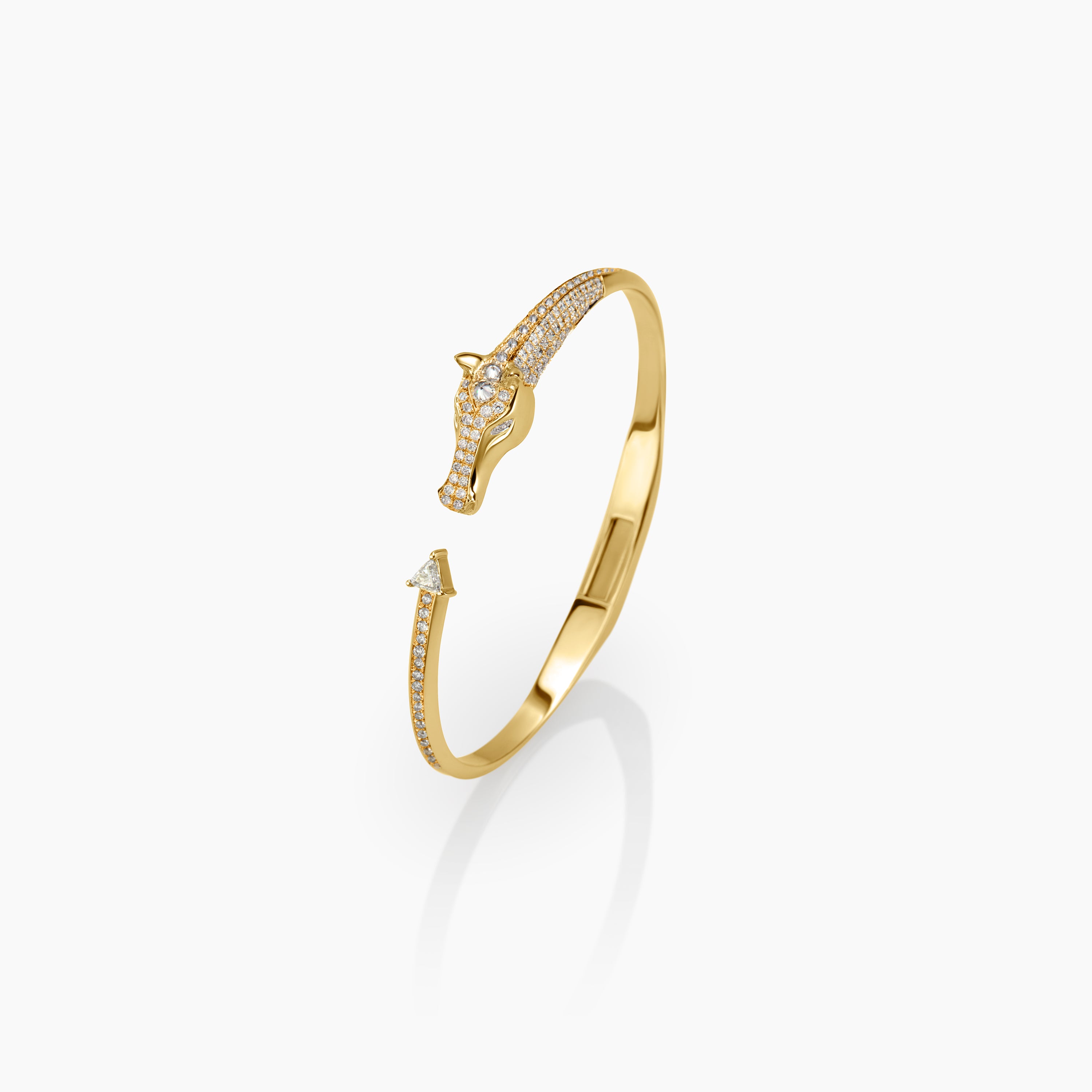 Gold bracelet with diamond accents on a white background horse design