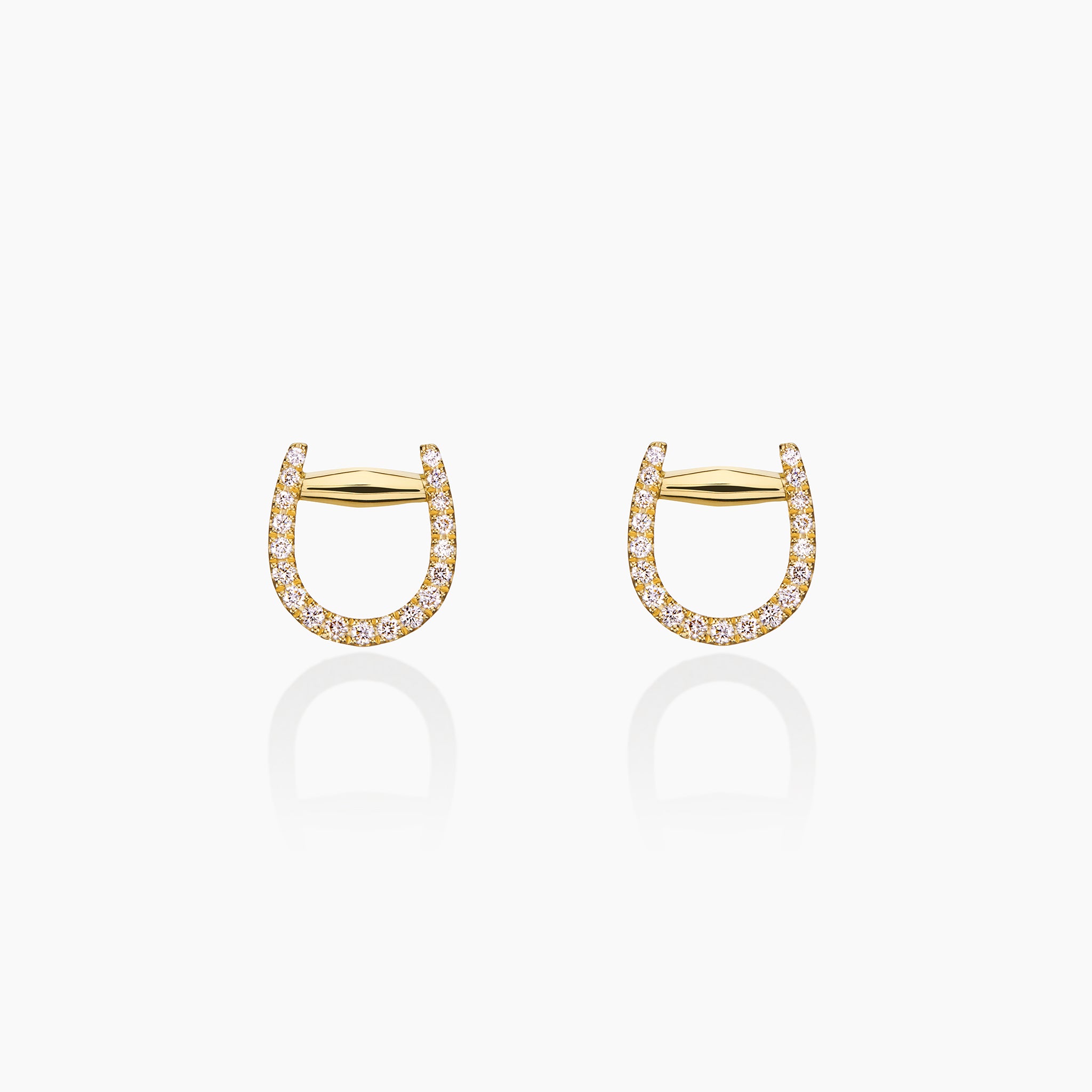 Fulanda Horsebit Studs against an off white background