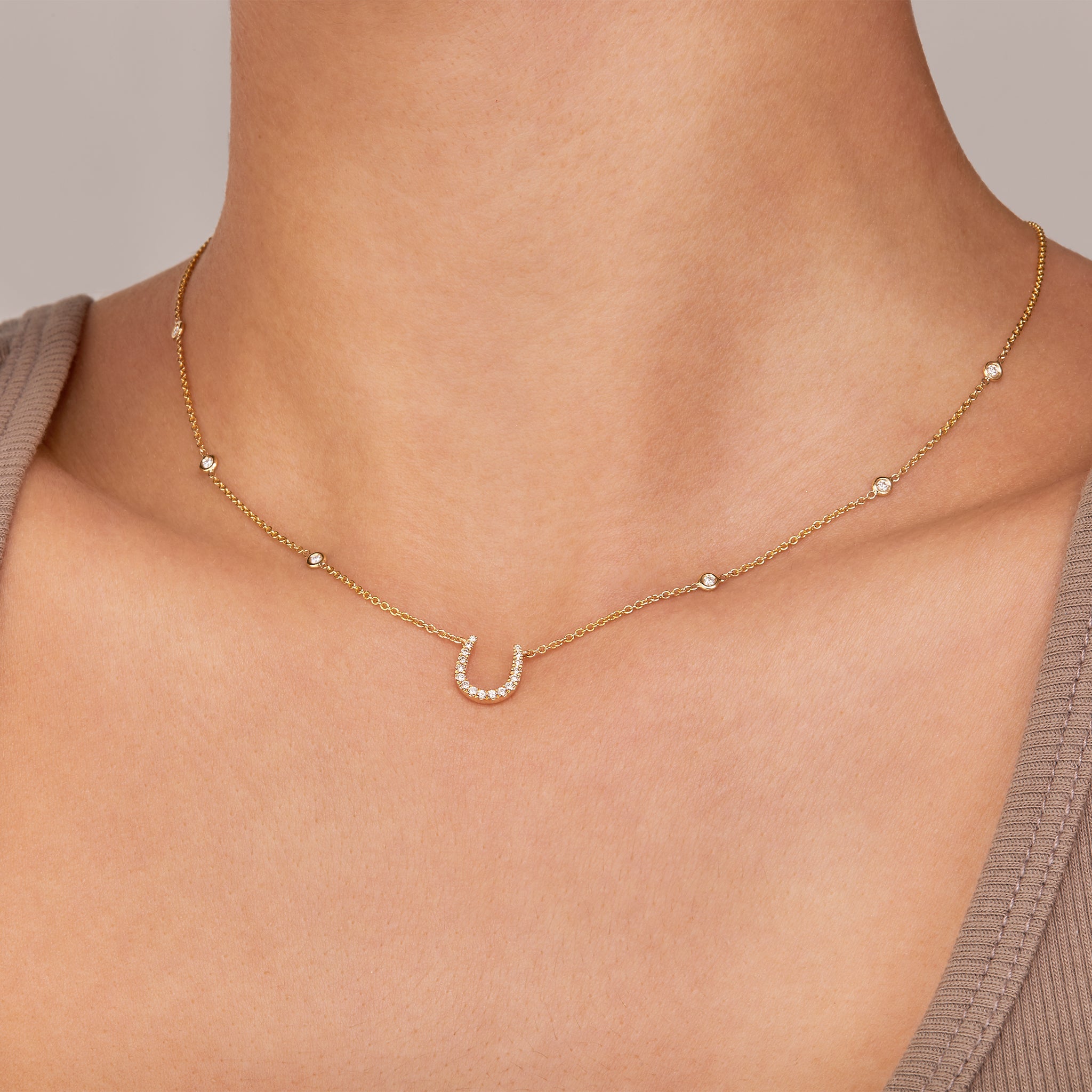 Fulanda Horseshoe Diamond Necklace in yellow gold displayed on a model.