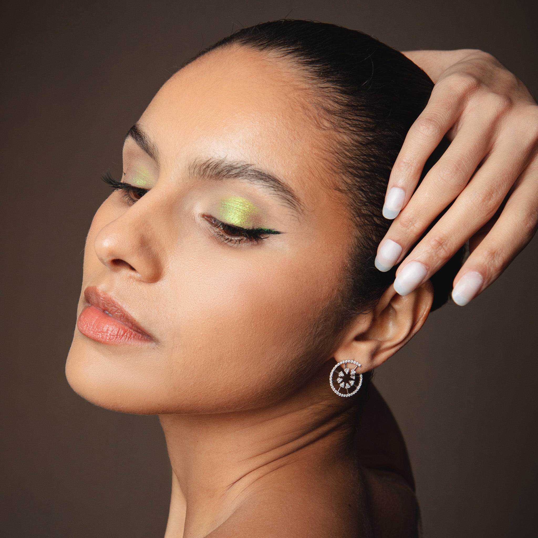 Hercules Earrings: Greek Mythology-Inspired Diamond Spiral Shield Design displayed on model.