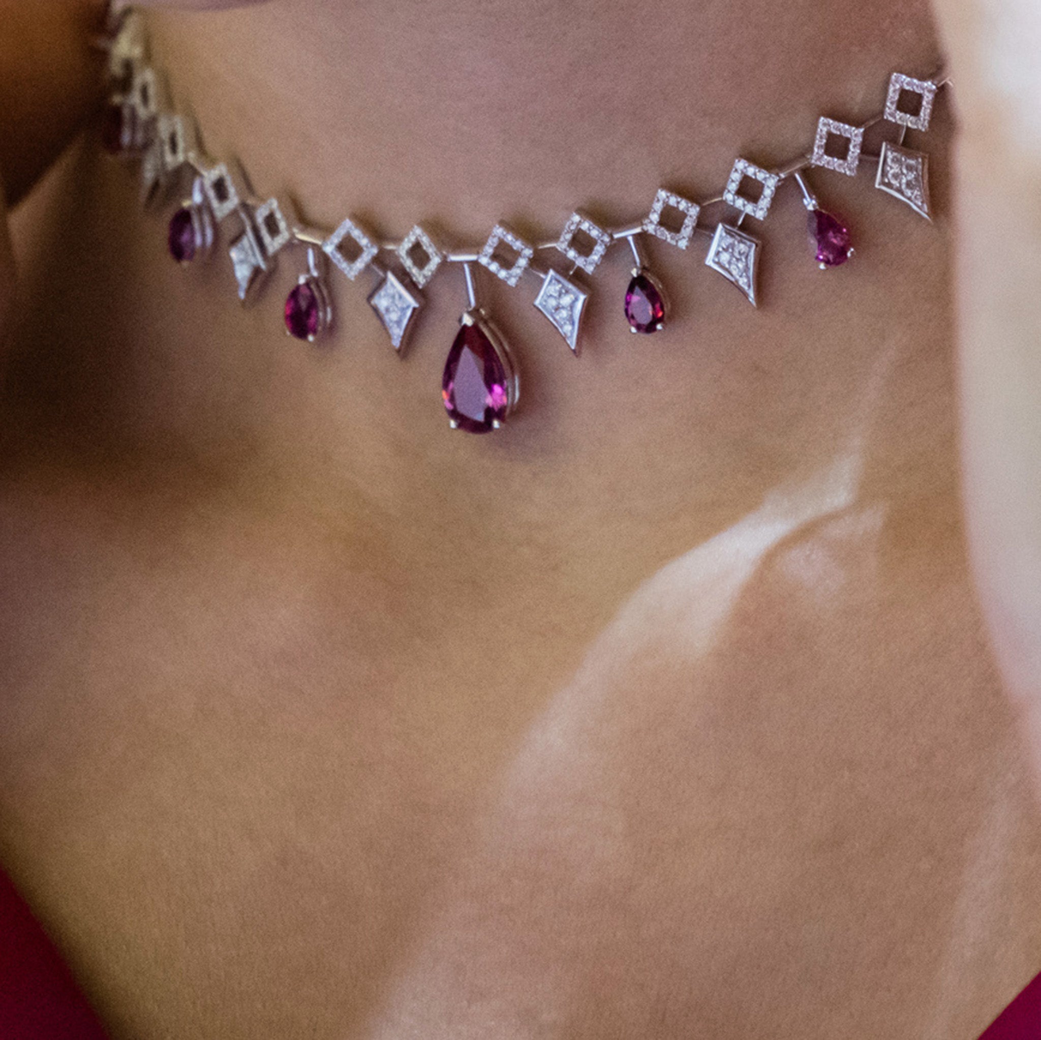 Inferno Choker: A captivating choker adorned with rubellite gemstones and diamonds set in white gold, presented on model.