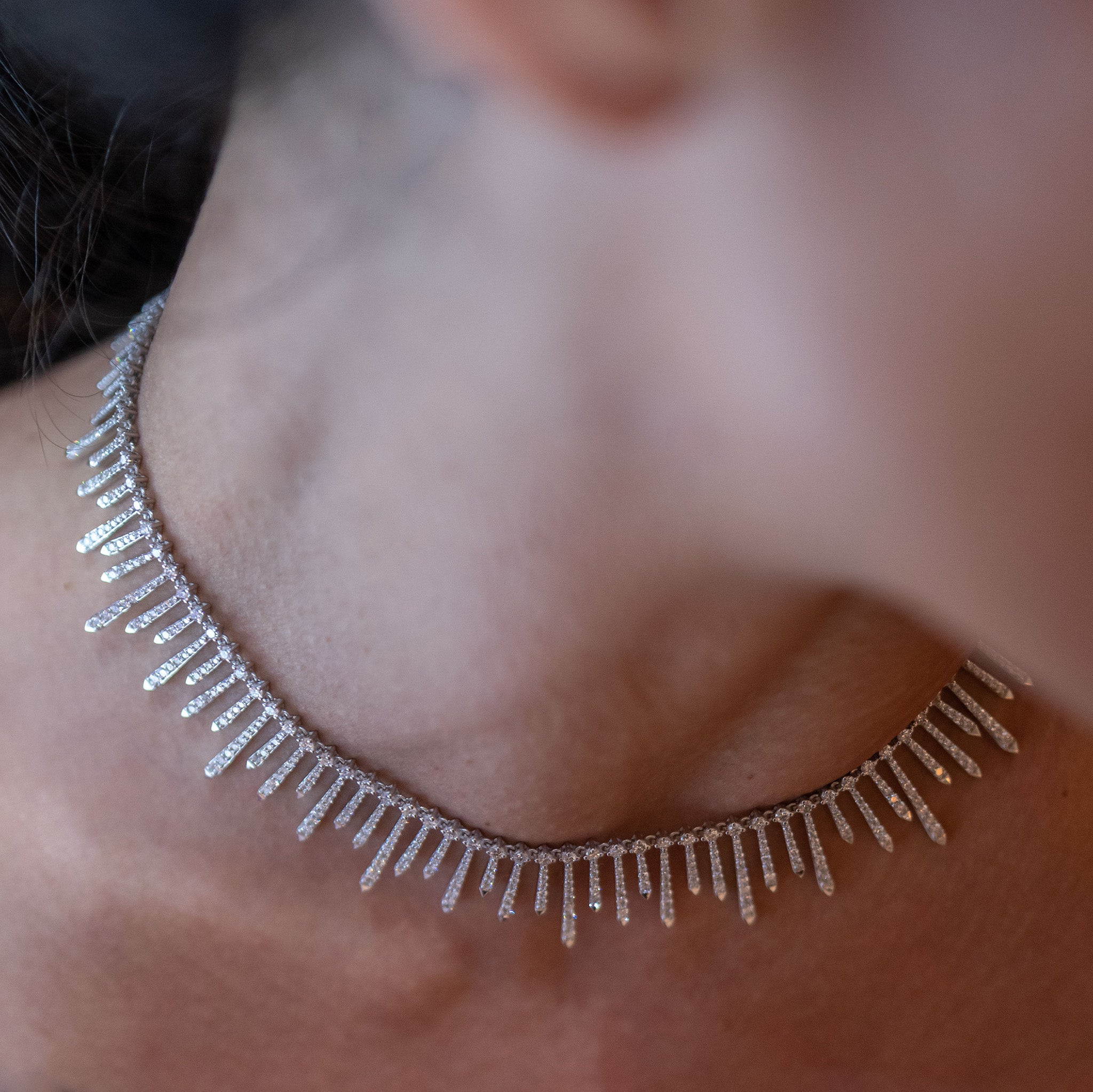 Polaris Necklace: A dazzling arrangement of diamonds set in white gold, showcased on model.
