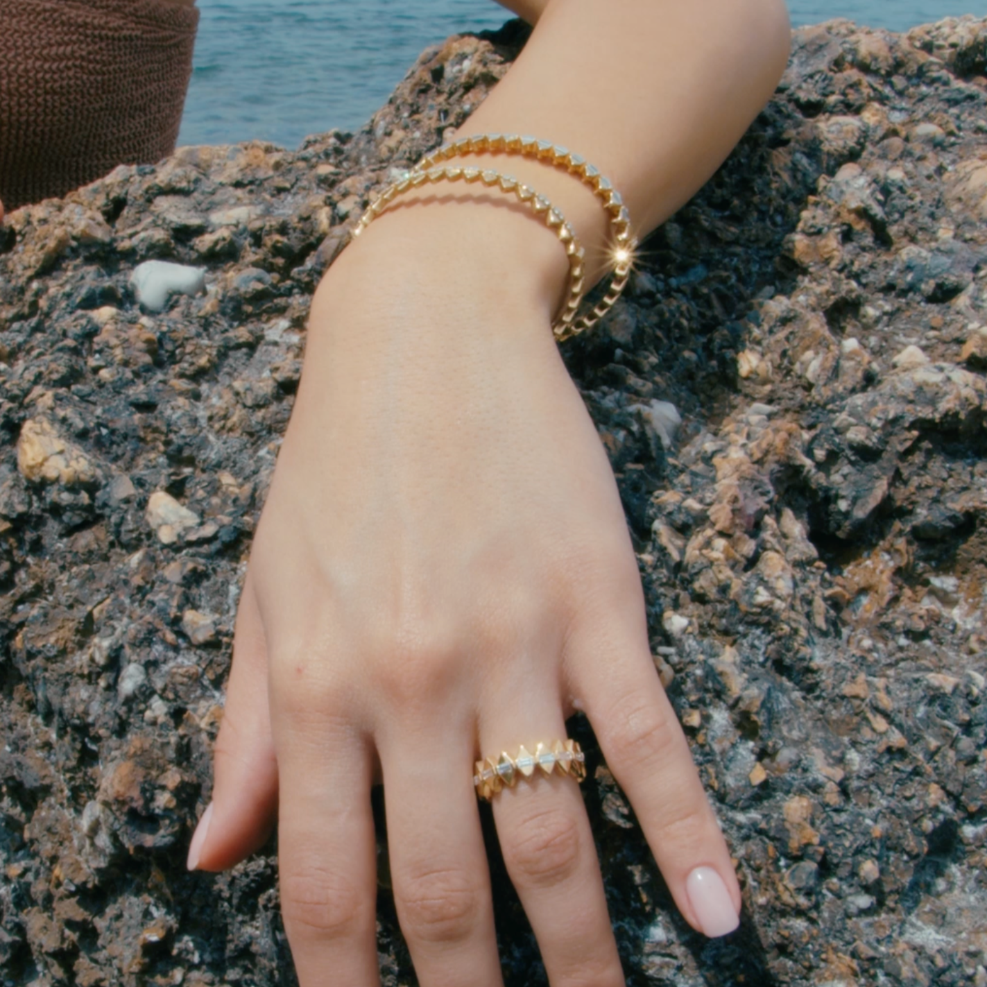 solidarity ring and bracelets on model