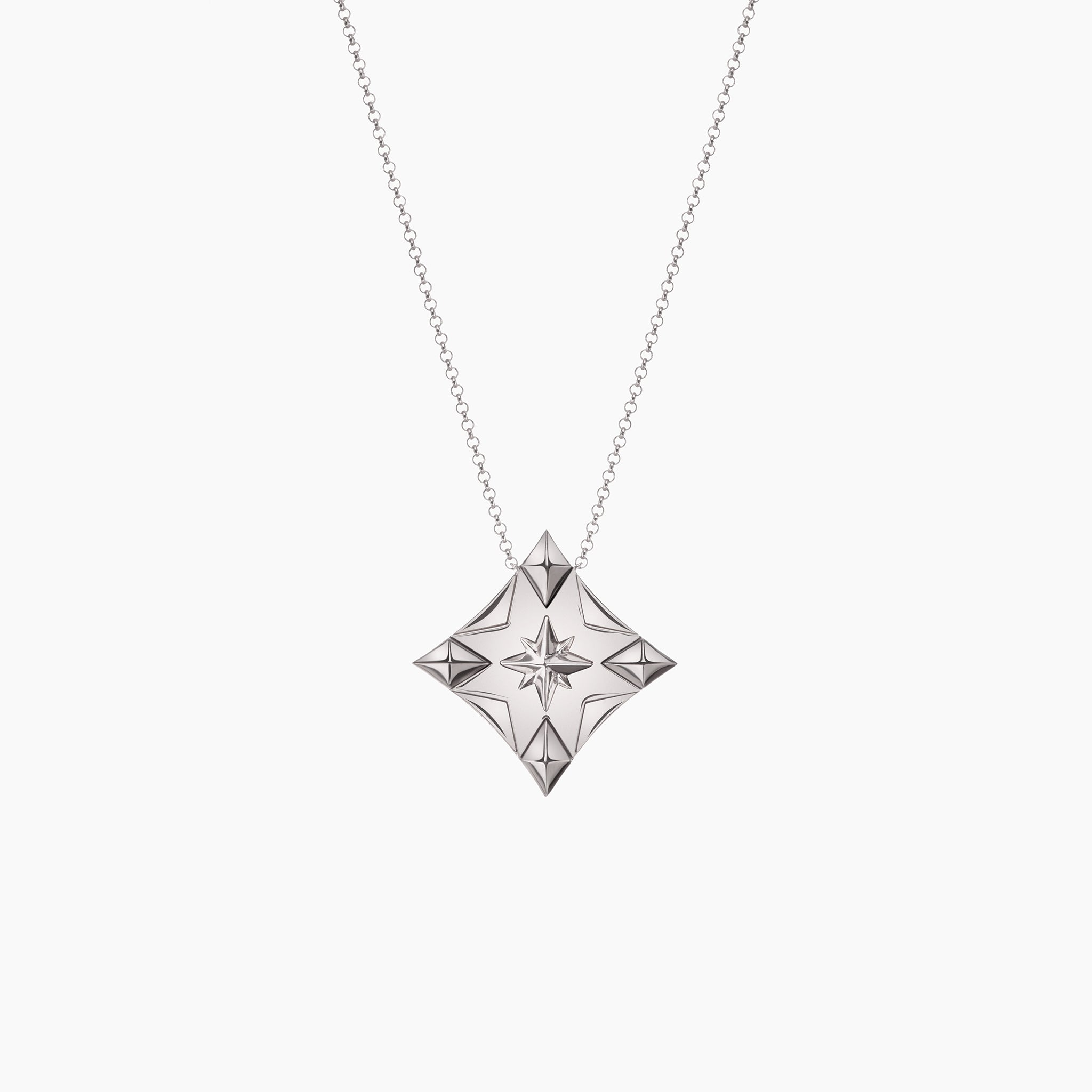 2025 Trust Your Inner Compass Lucky Charm against an off white background in white gold