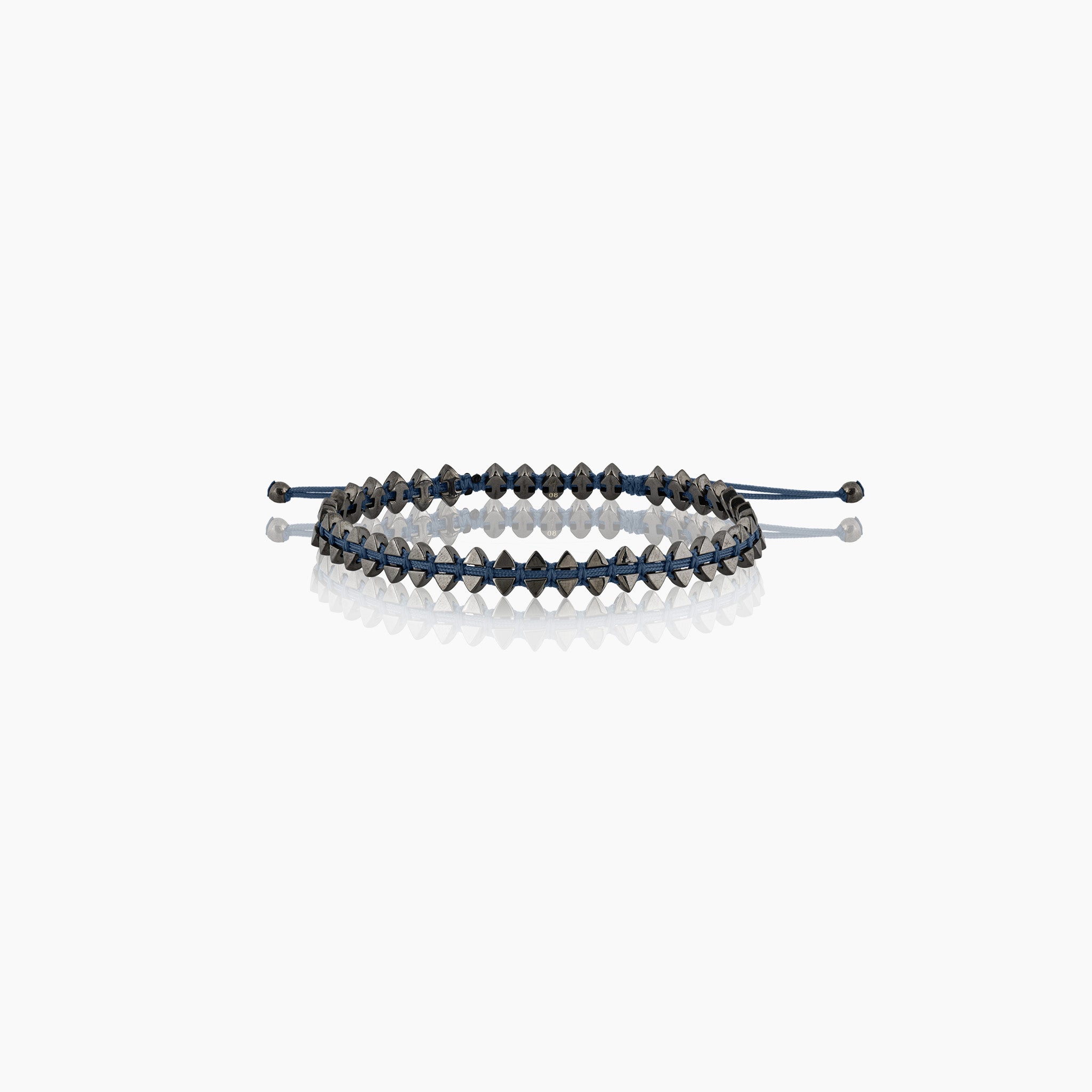 Men's dual-sided anchor bracelet with anchor and boat-inspired triangle motifs, showcased against an off-white background.