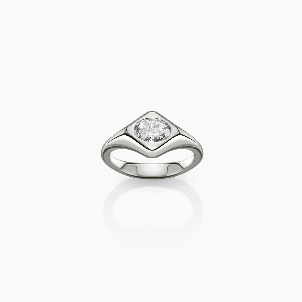 Astra diamond ring shown on a light gray reflective background.