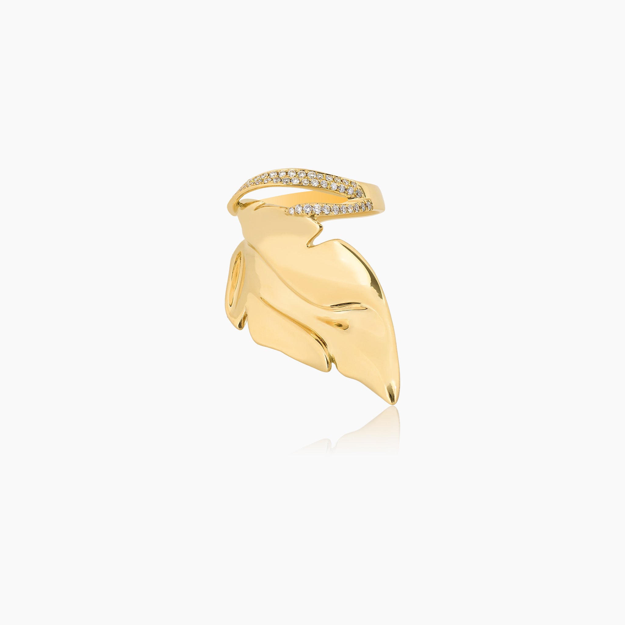 Hand-carved yellow gold leaf-shaped ring, adorned with exquisite details and diamonds, displayed against an off-white background.