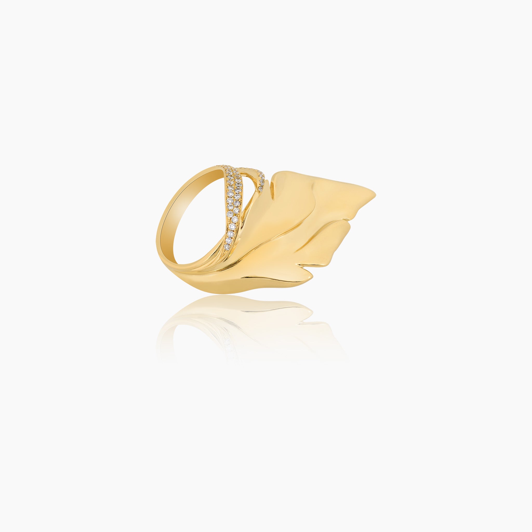 Hand-carved yellow gold leaf-shaped ring, adorned with exquisite details and diamonds, displayed against an off-white background.(sideview)