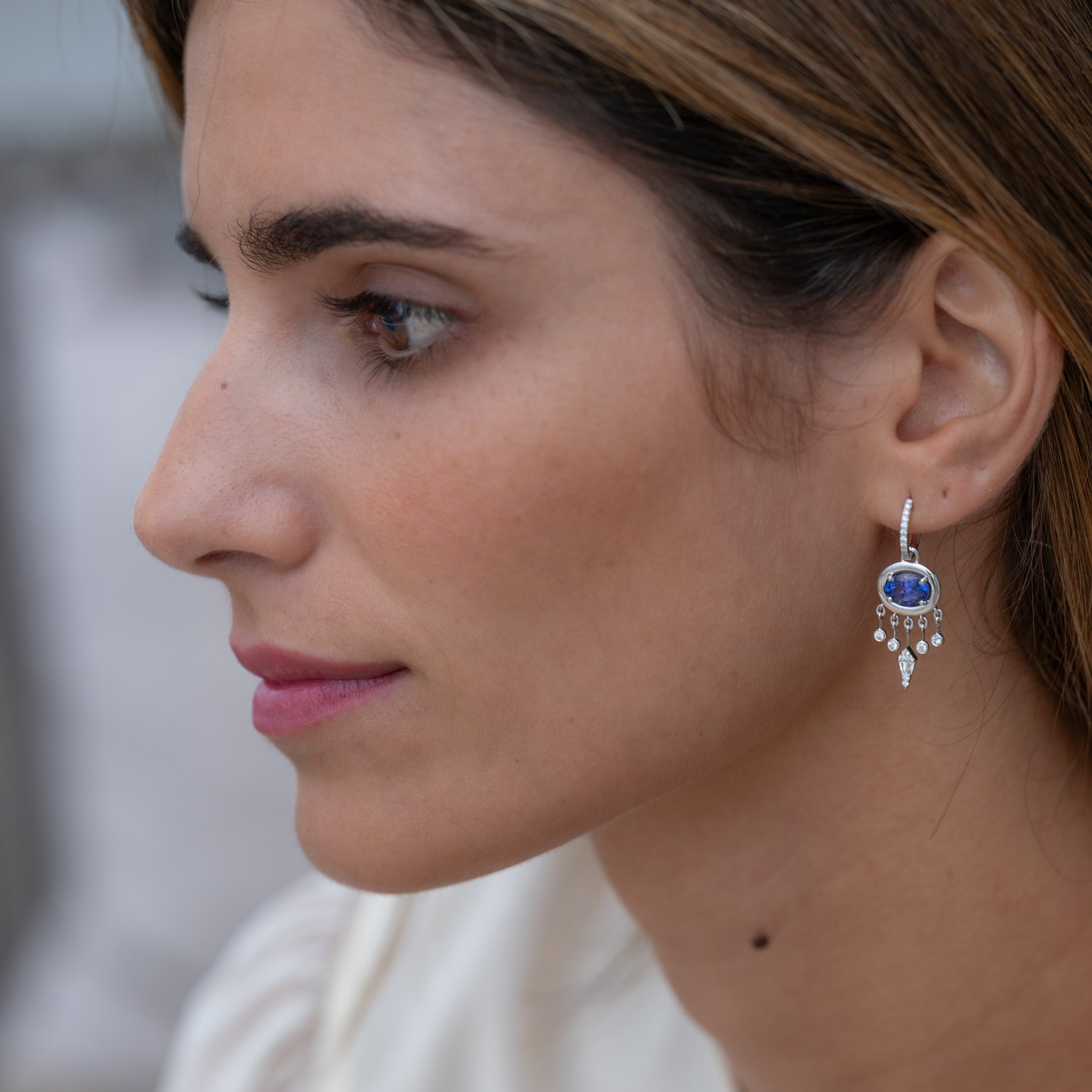 Gypset Earrings: Diamond and Tanzanite Jewellery Set on a model.