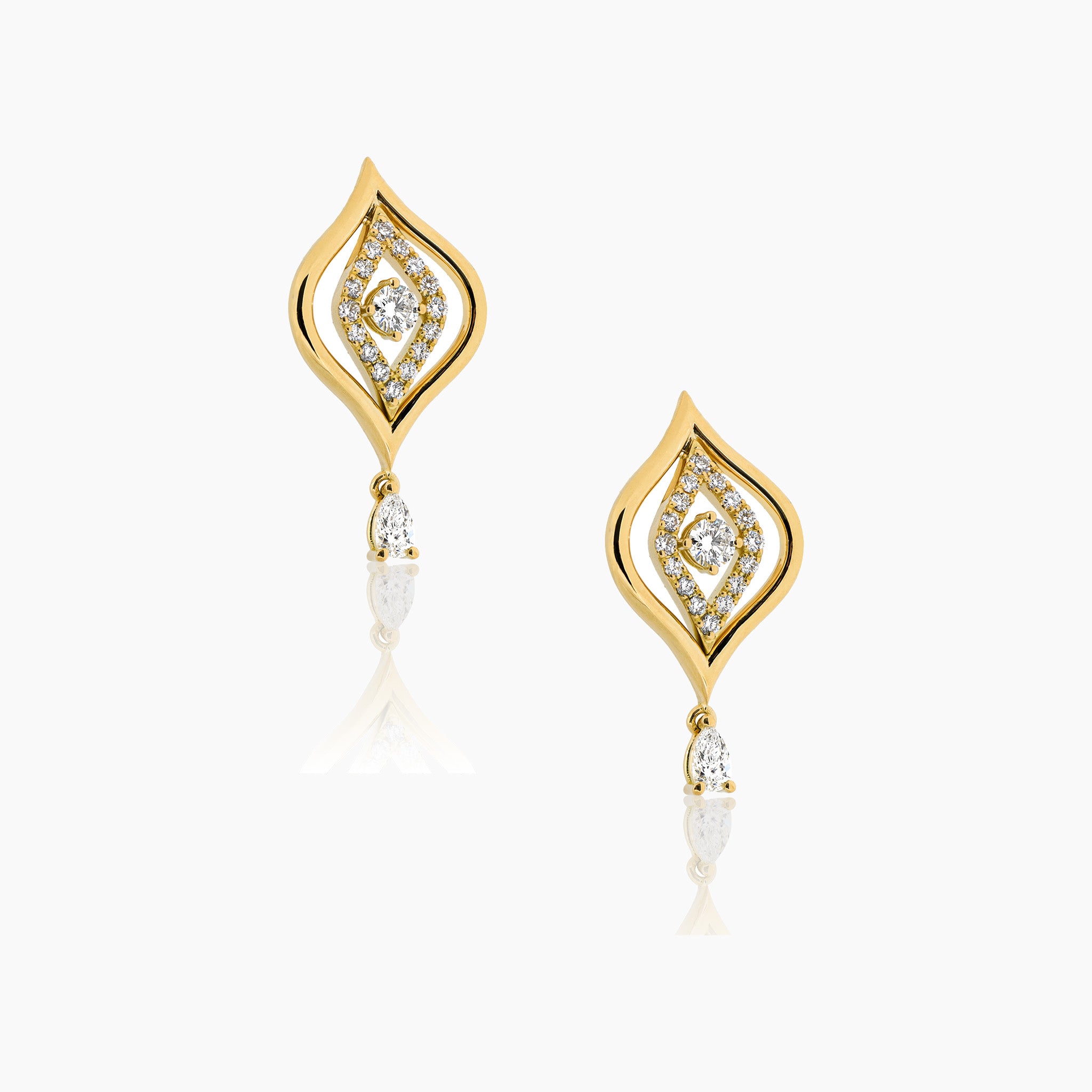 Yellow gold and diamond earrings with a captivating Evil Eye design, set against a clean off-white background.