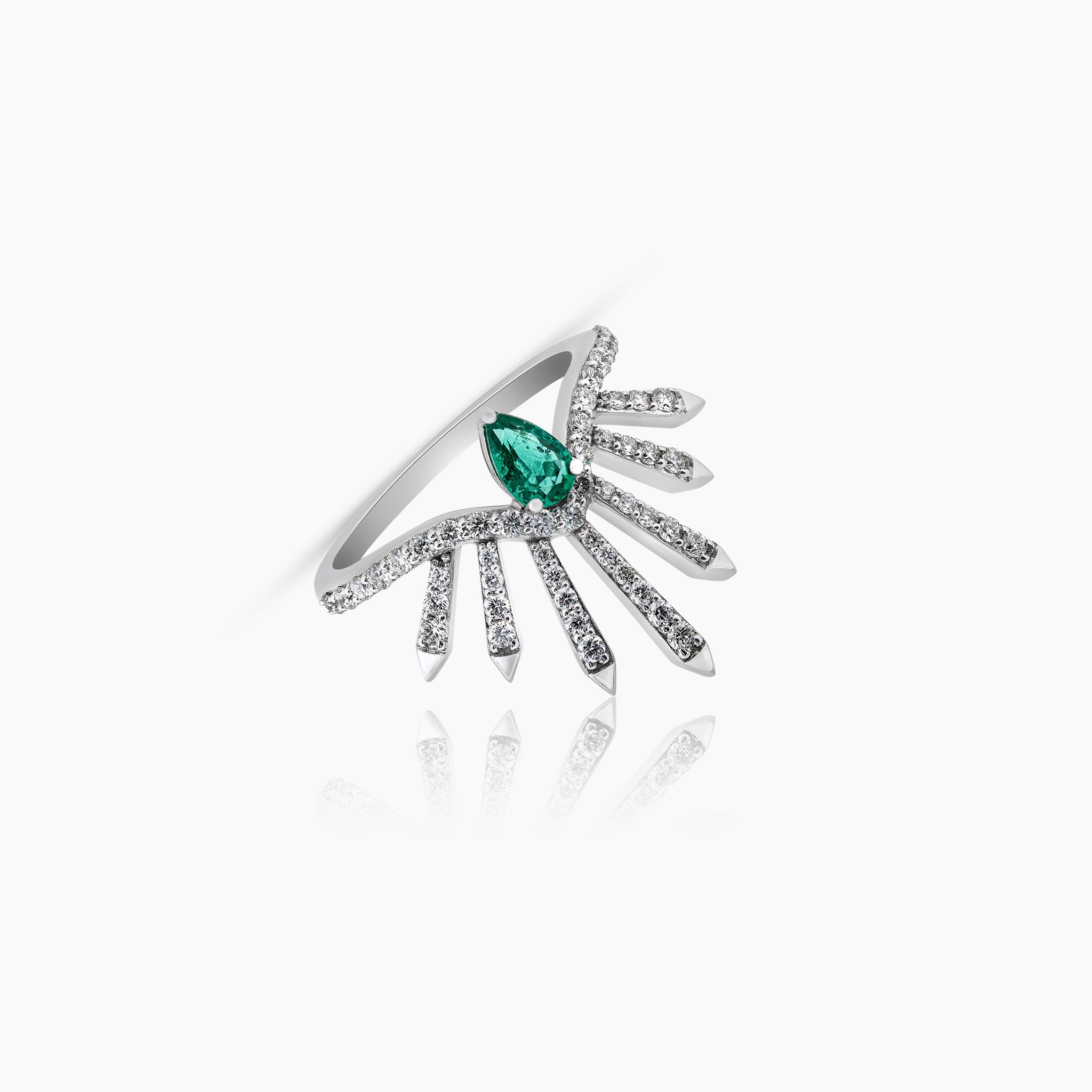 Dragon Ring: Crafted in white gold and adorned with a single Zambian emerald and diamonds, displayed against an off-white background.