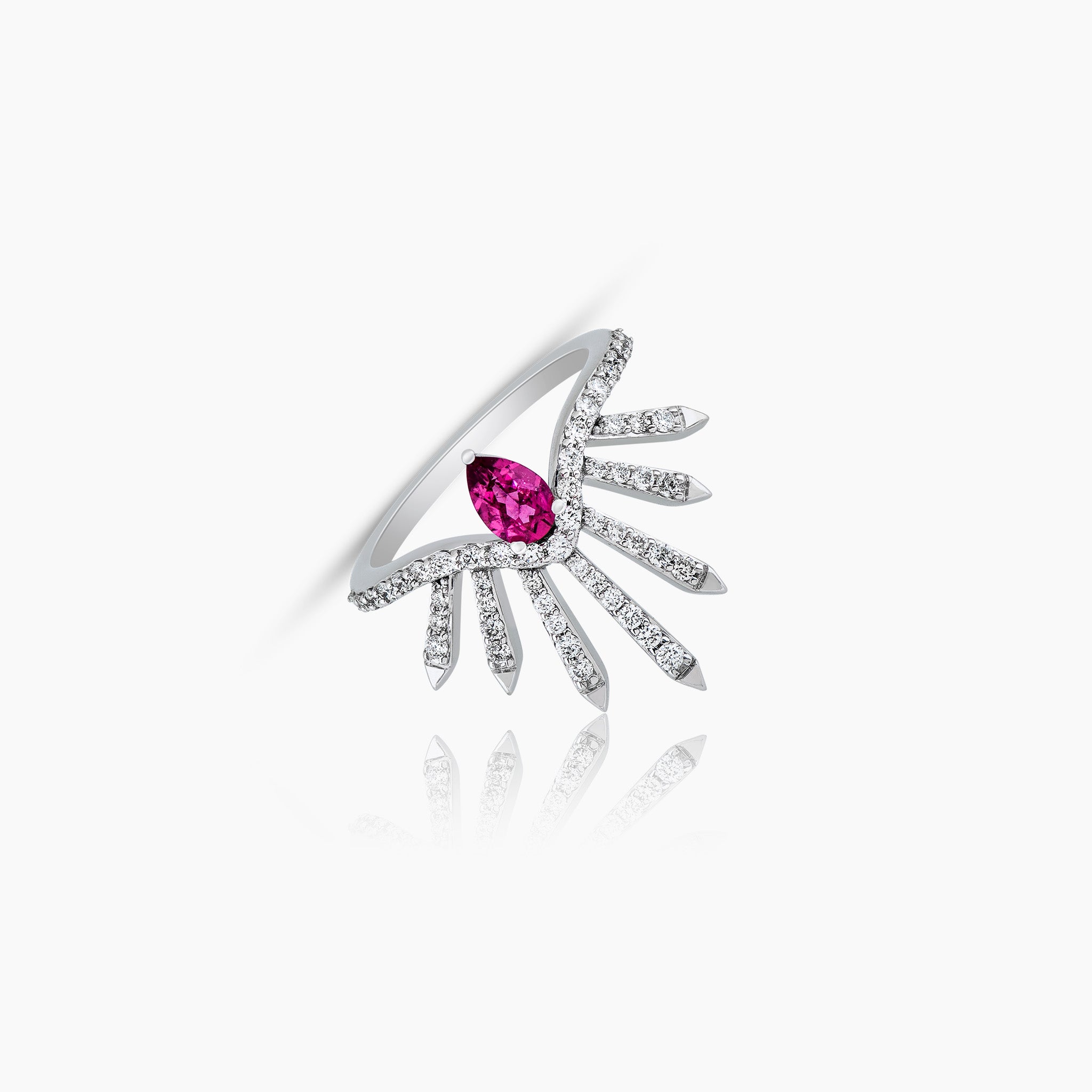 Dragon Ring: Crafted in white gold and adorned with a single rubellite pear and diamonds, displayed against an off-white background.