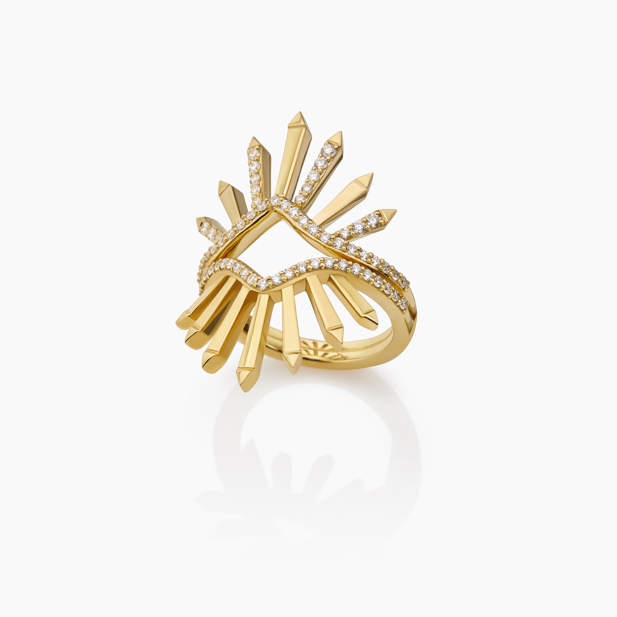 Yellow Gold Rings that can be worn together featuring radiant sunburst motifs adorned with diamonds, showcased against an off-white background.