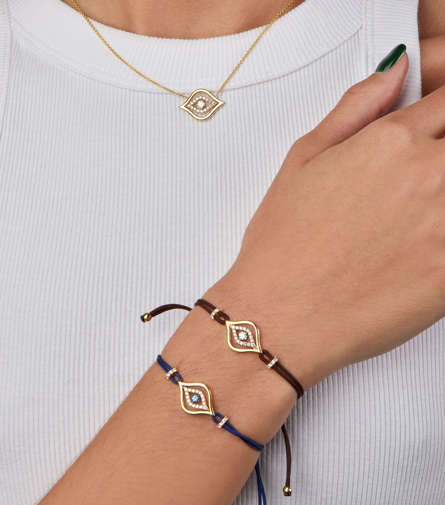 Evil eye cord bracelets portrayed on hand model.