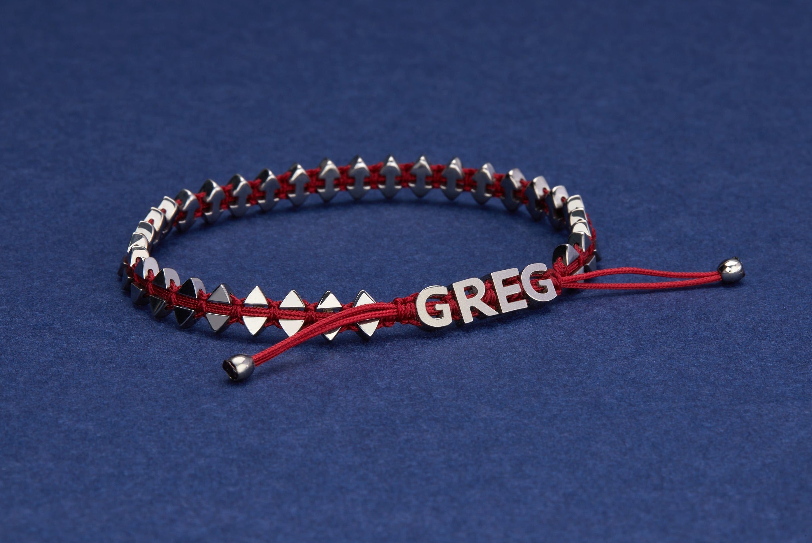 Personalised men's dual-sided anchor bracelet with anchor and boat-inspired triangle motifs, showcased on model. 
