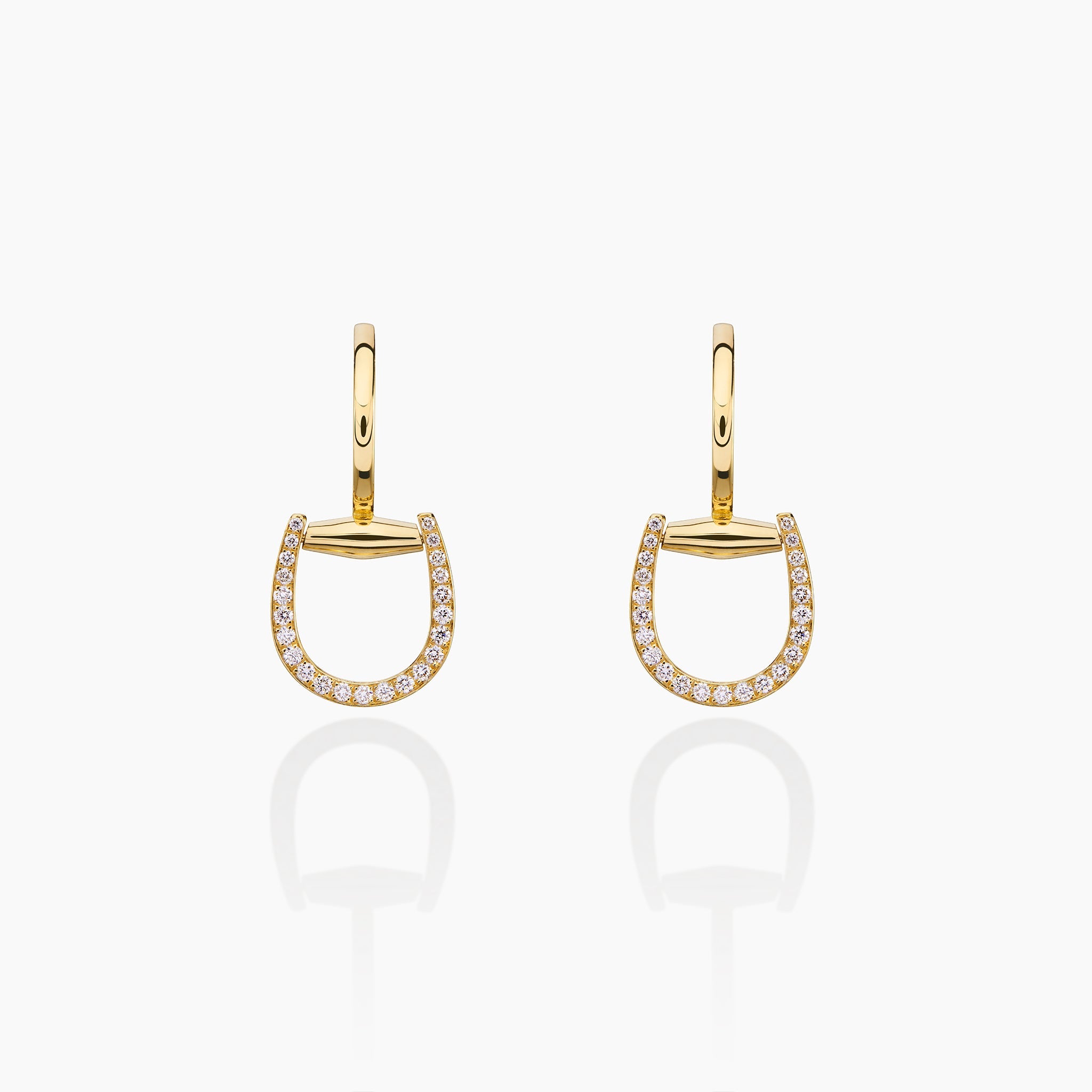 Convertible Horsebit Hoop Earrings displayed against off white background 