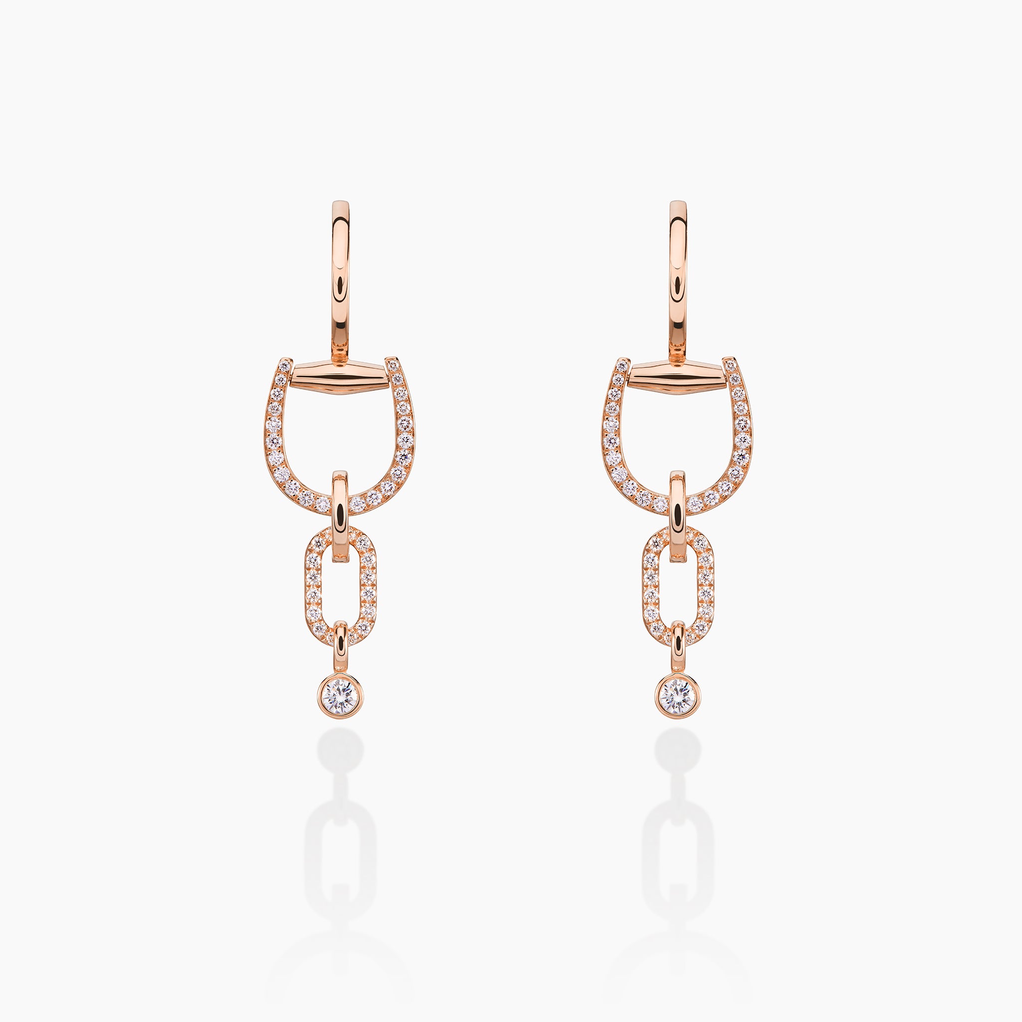 Convertible Horsebit Hoop Earrings displayed against off white background 

