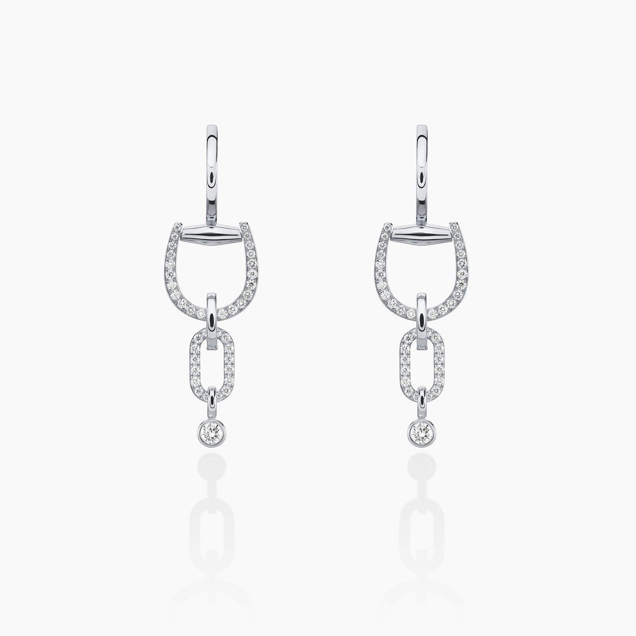 Convertible Horsebit Hoop Earrings displayed against an off white background 