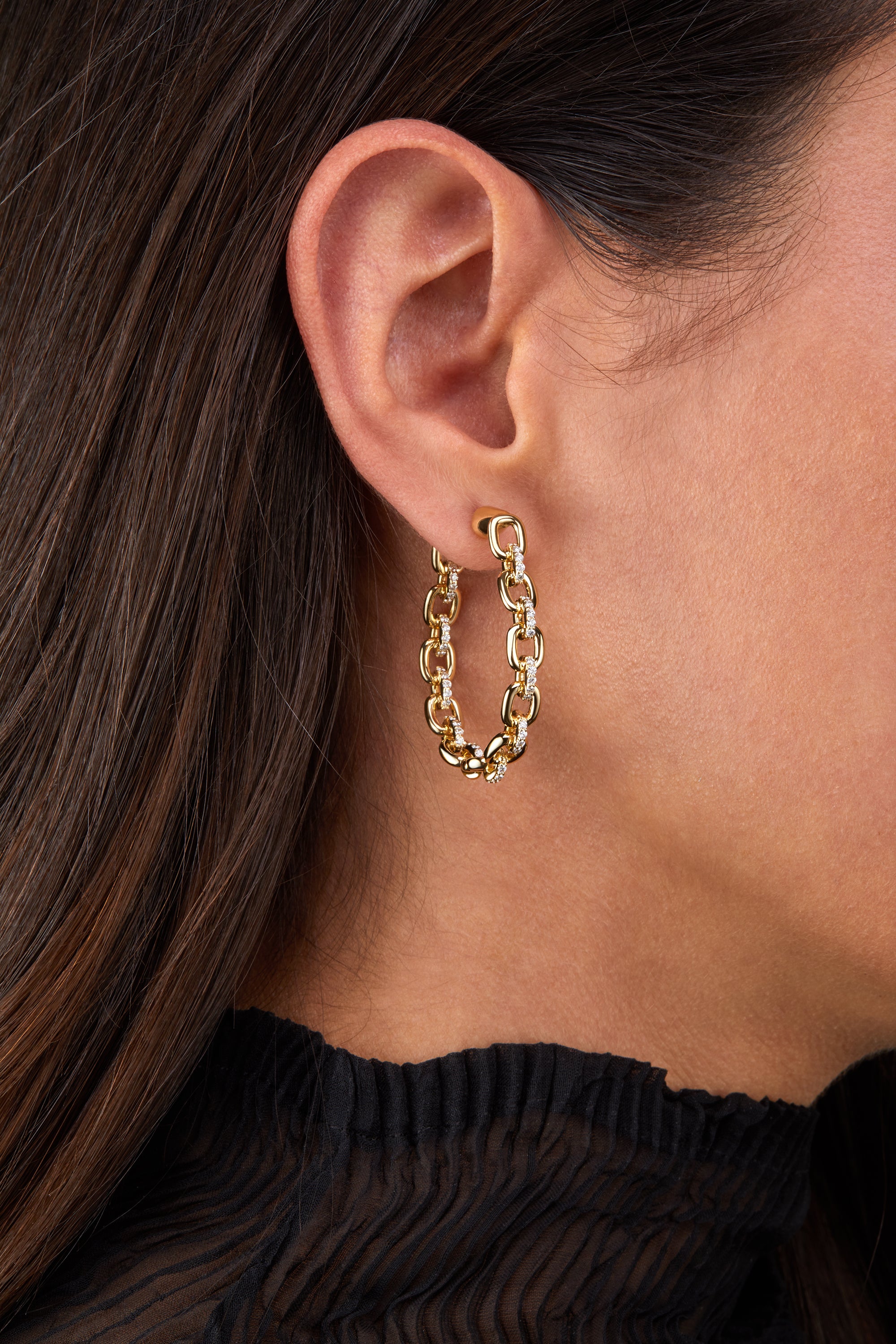 Horsebit Diamond link Hoop Earrings in yellow gold displayed on model