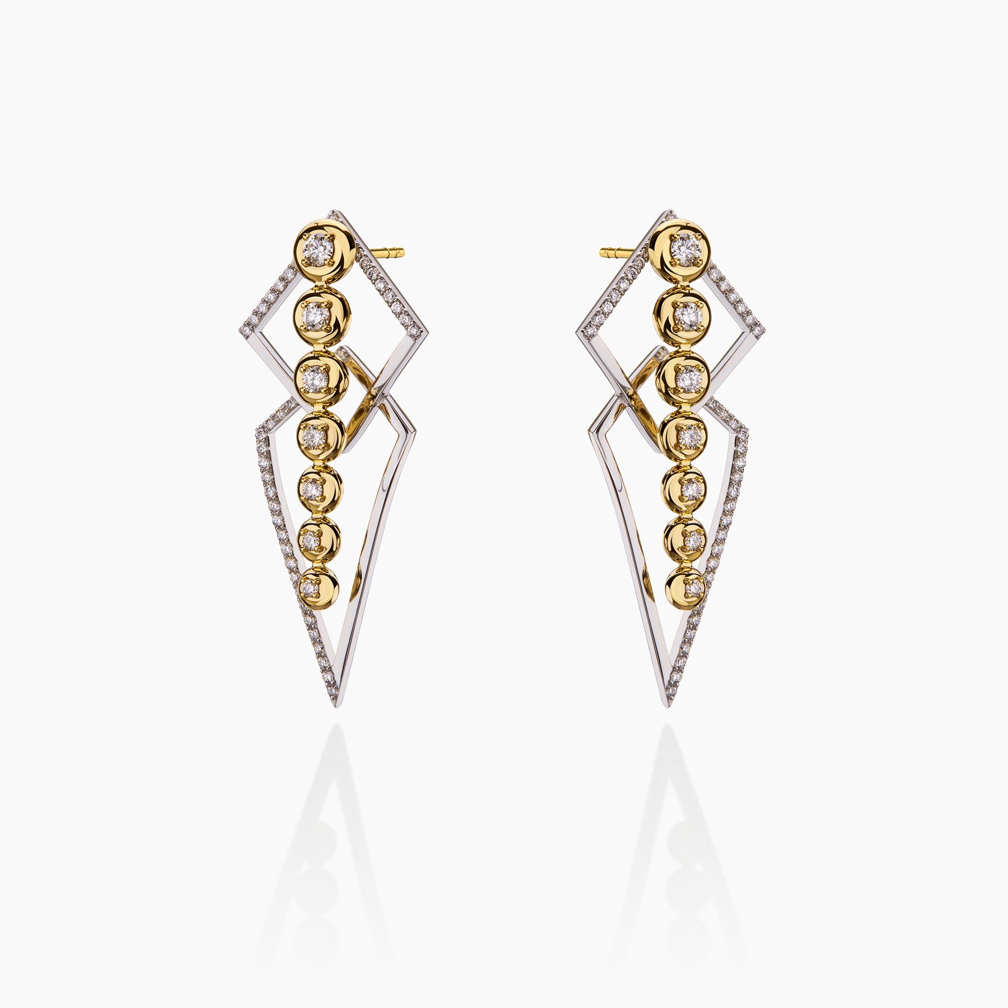 thunder and star trail earrings across an off white background depicting how the can be both worn together.