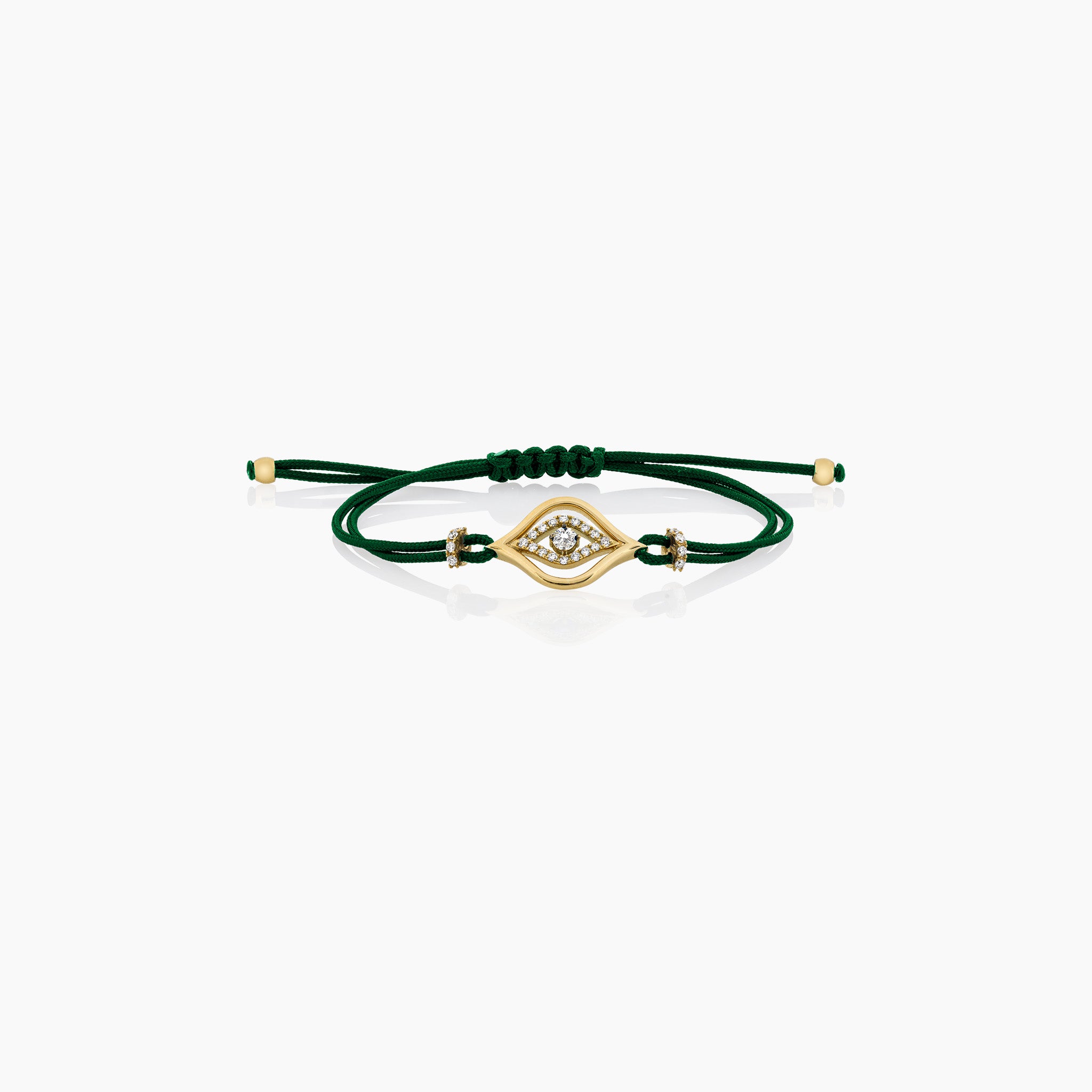 A stylish evil eye cord bracelet featuring diamonds, set on a cord, presented against an off-white background. 