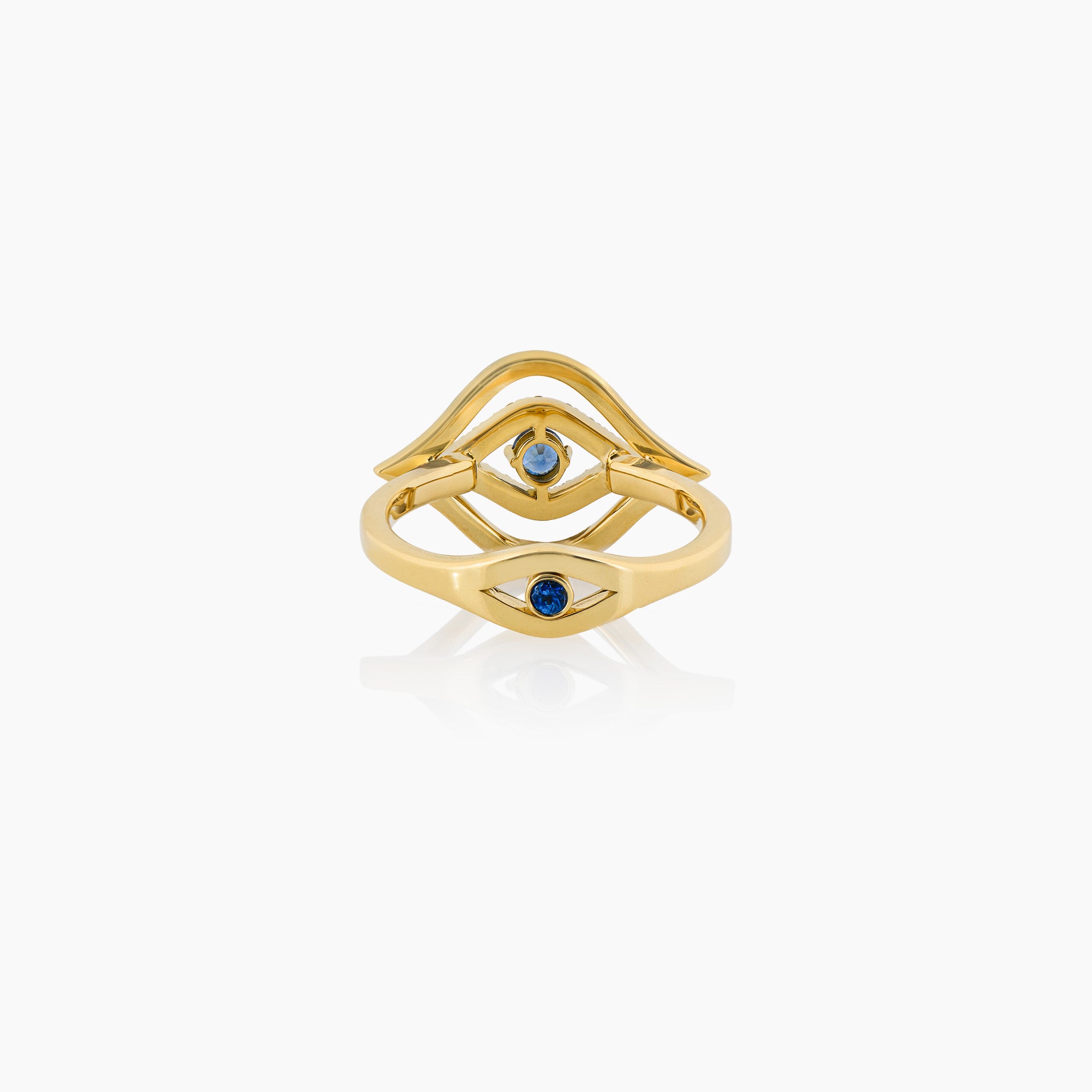 A stunning diamond and sapphire ring, presented on an off-white background.