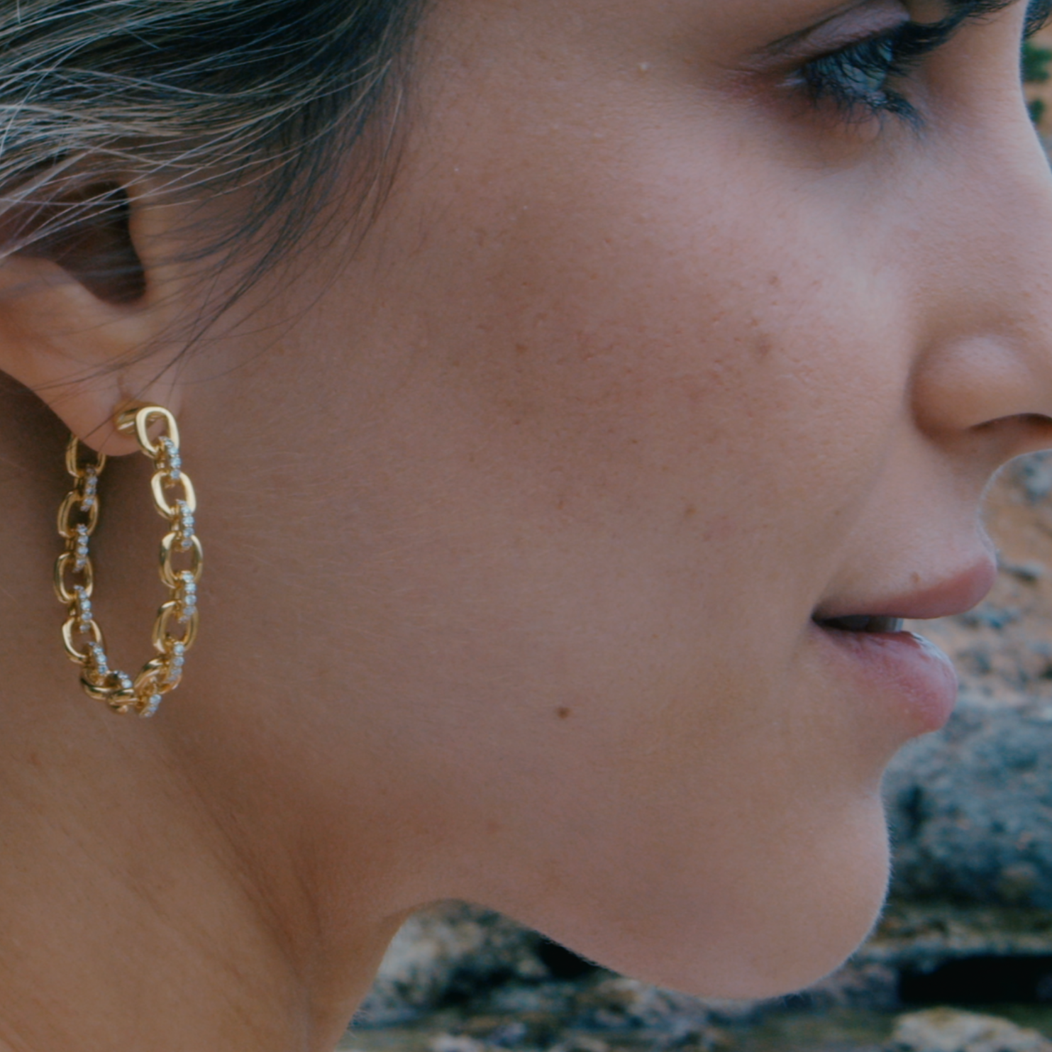 Horsebit Diamond link Hoop Earrings in yellow gold displayed on model