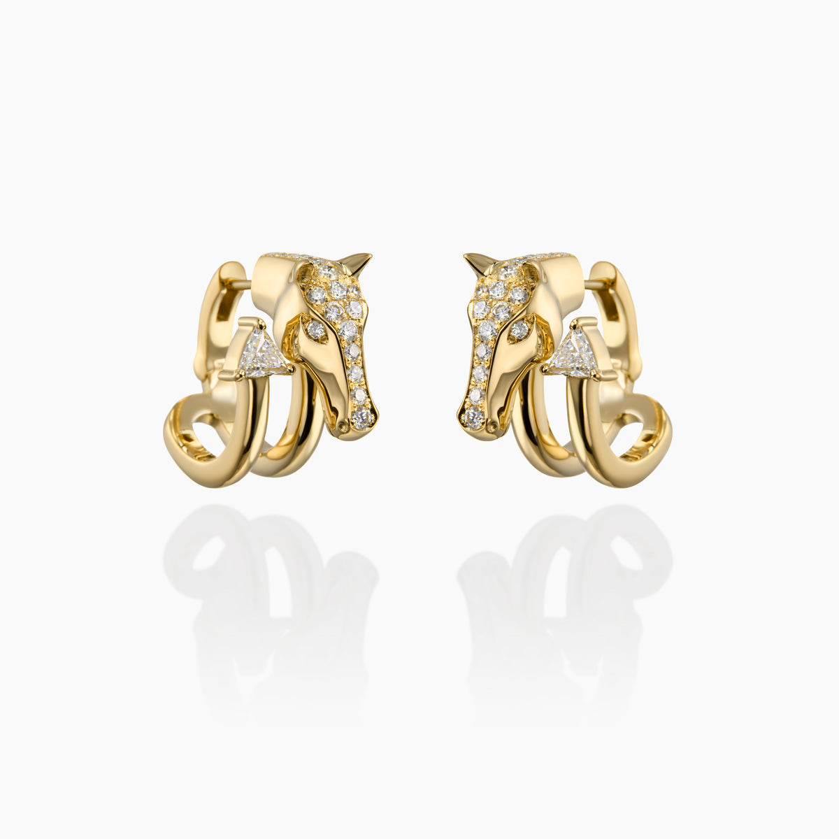Gold horse earrings with diamond accents on a white background