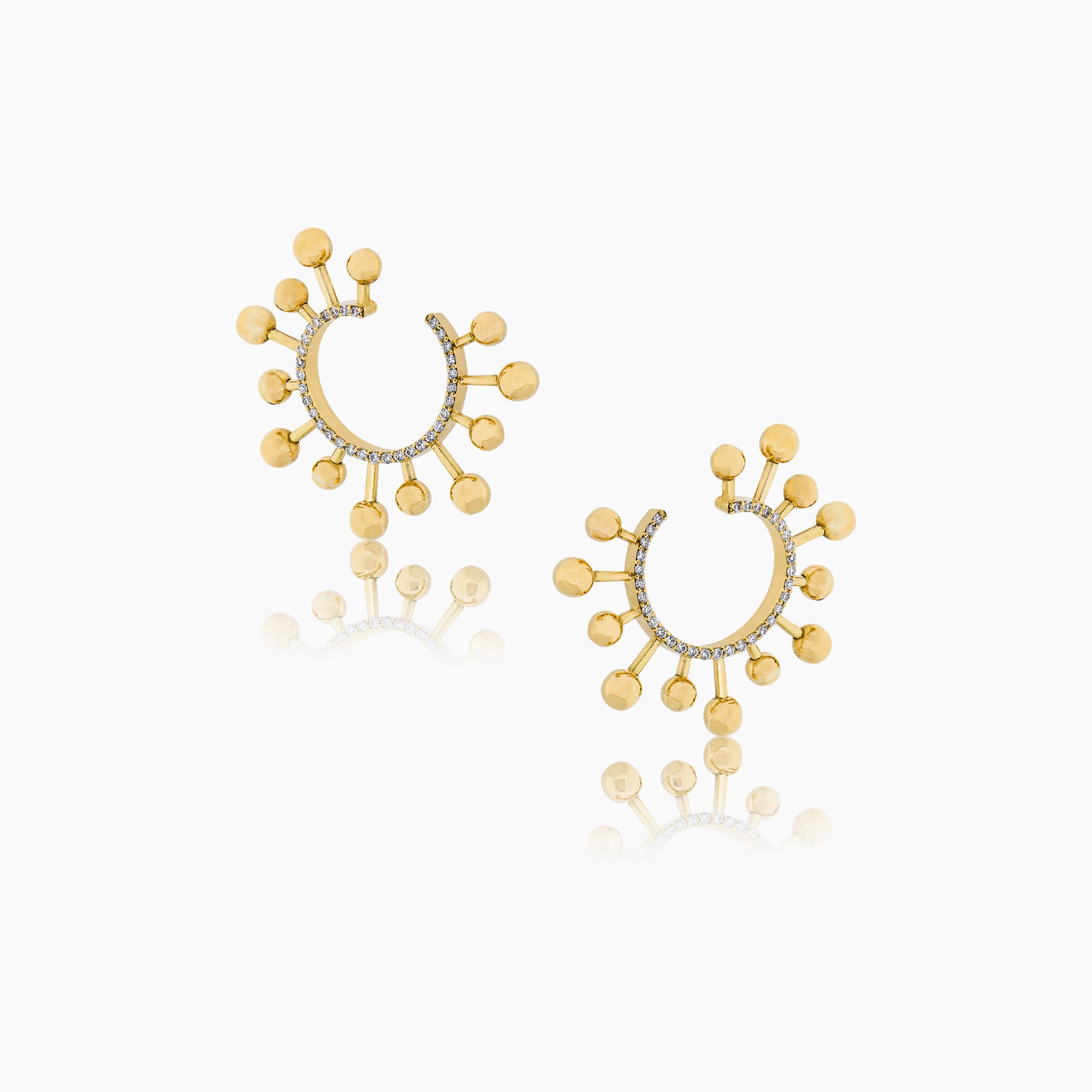 Helios Earrings: Radiant sun-inspired fine jewellery, set against an elegant off-white backdrop