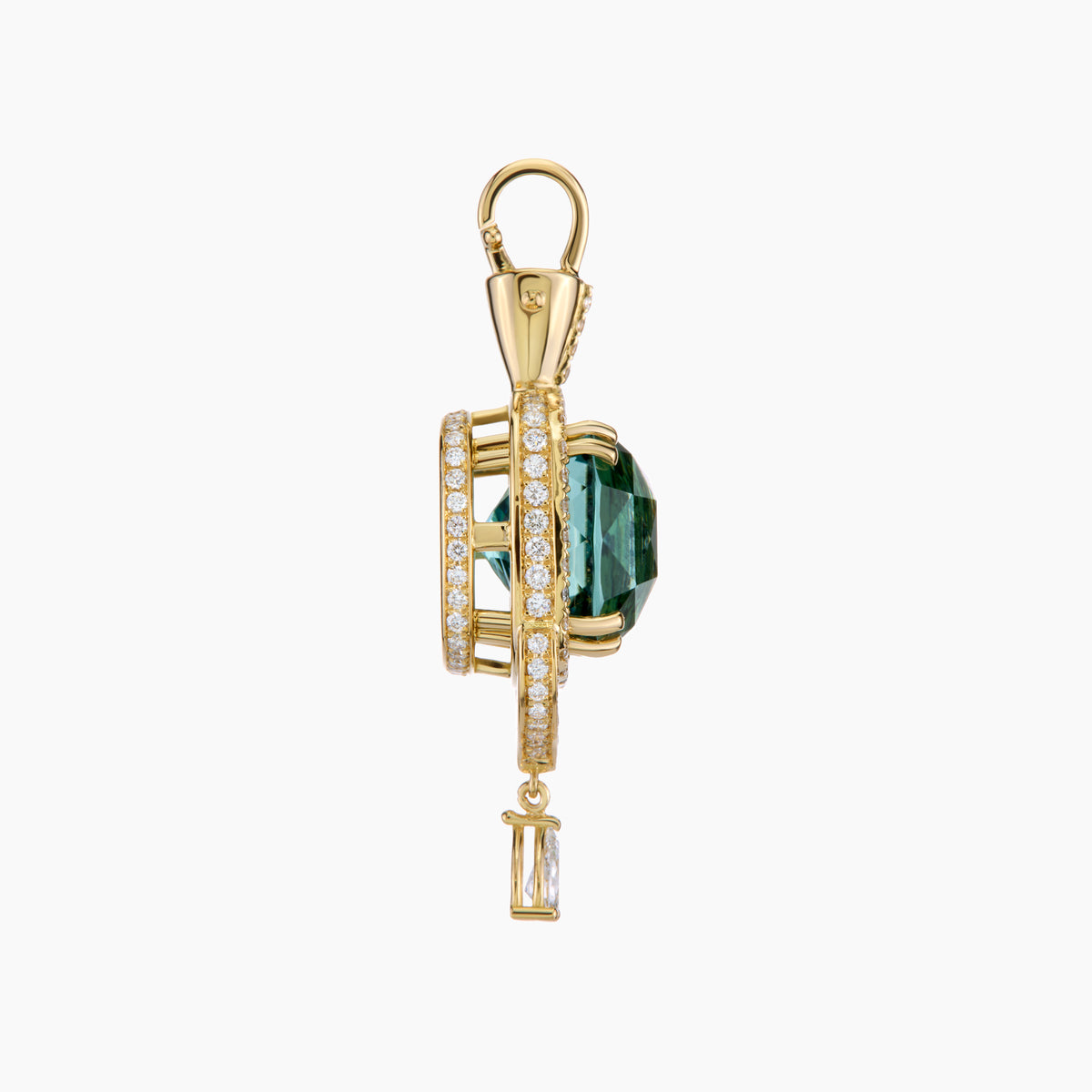 Gold pendant with a tourmaline gemstone on a white background
