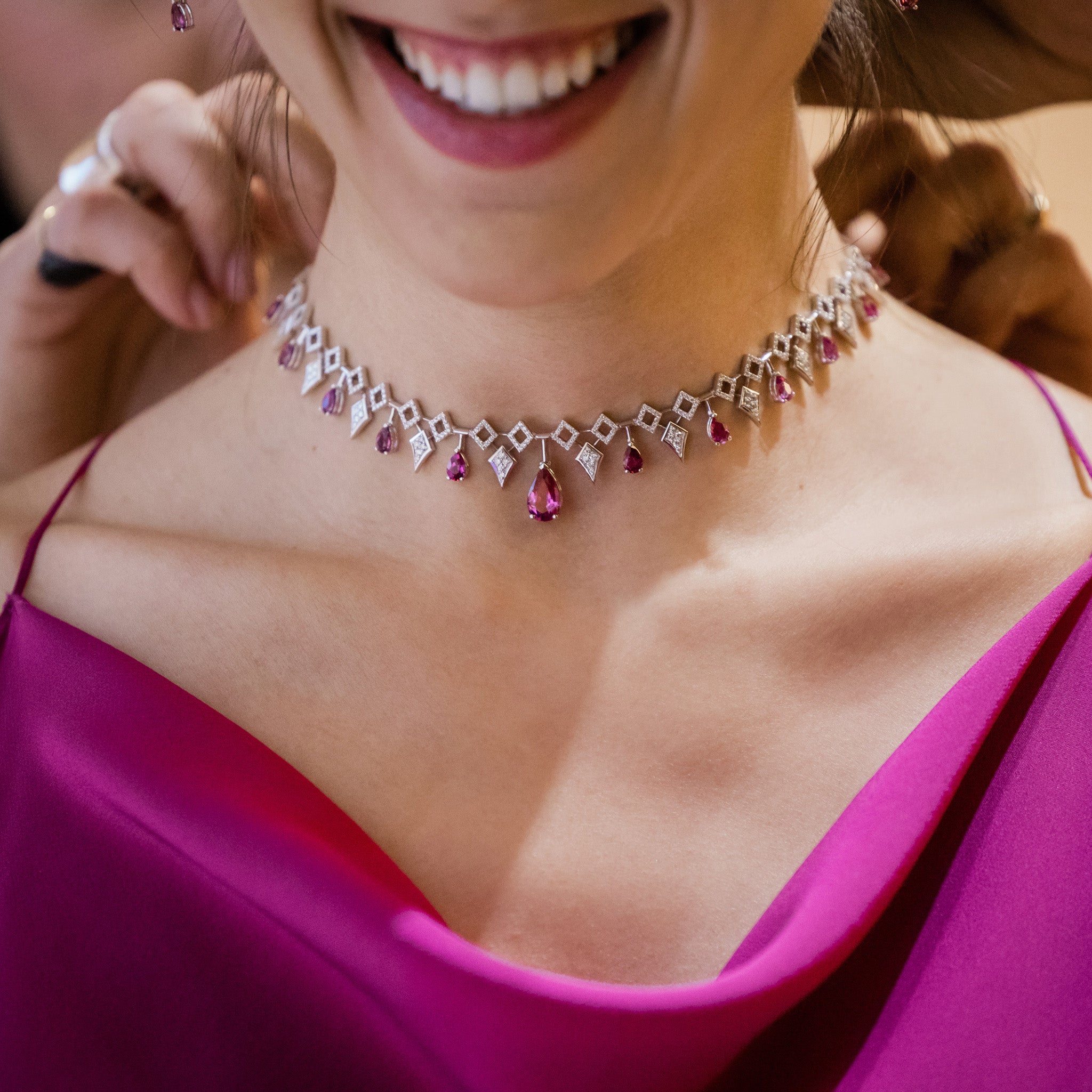Inferno Choker: A captivating choker adorned with rubellite gemstones and diamonds set in white gold, presented on model. 