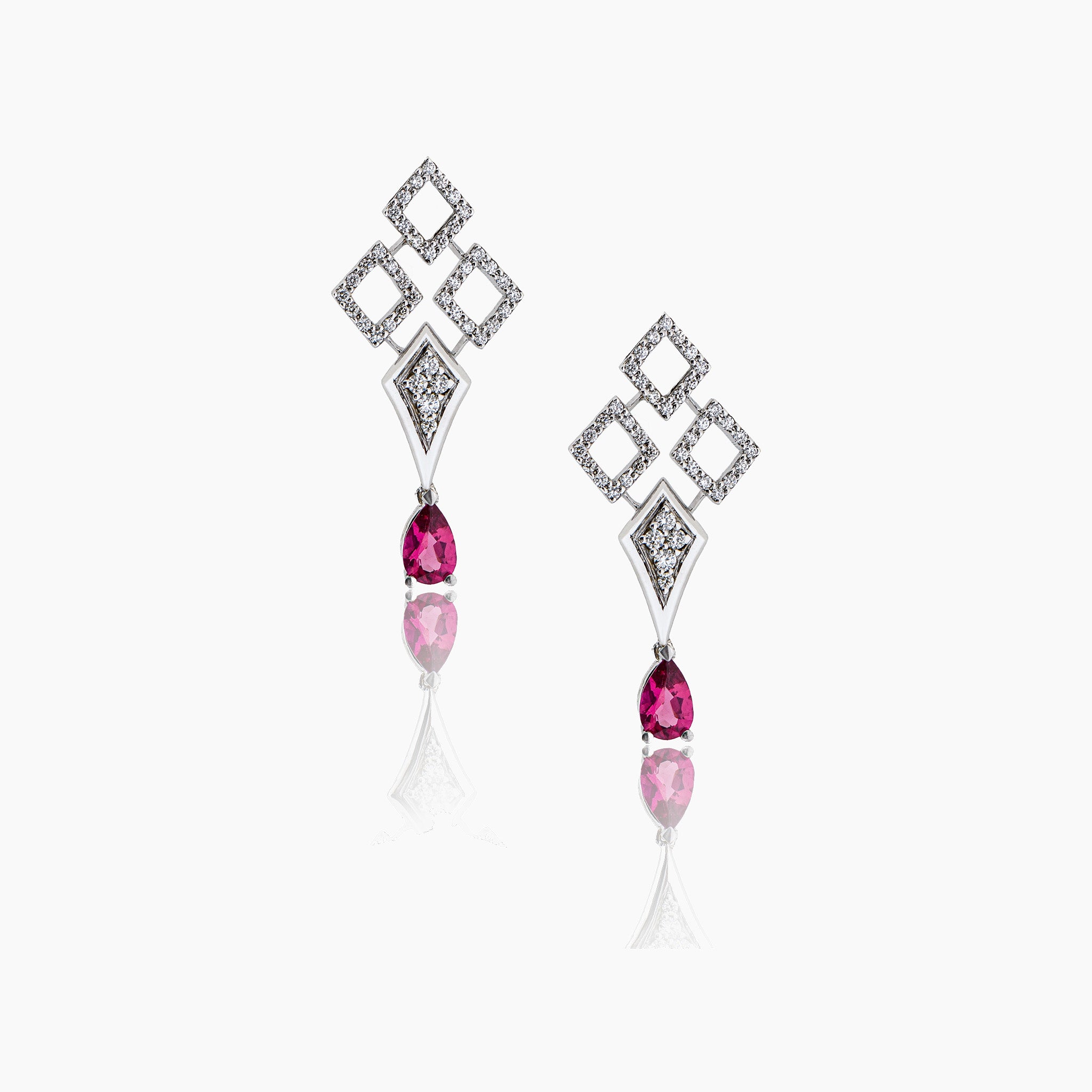 Diamond drop earrings with two stunning rubellite pears, fine jewellery on an off-white background