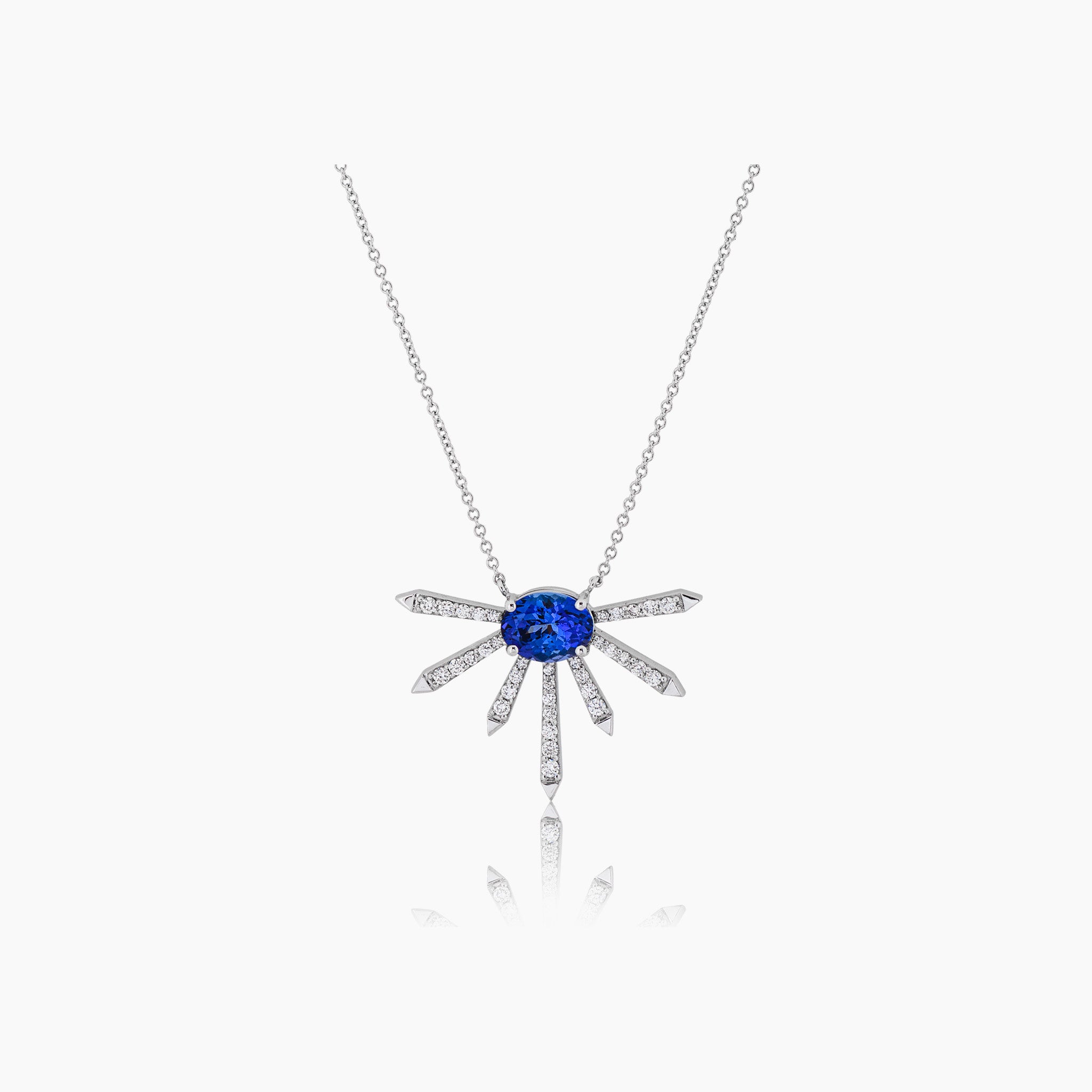 A breathtaking pendant featuring a stunning Tanzanite center stone surrounded by dazzling diamonds.