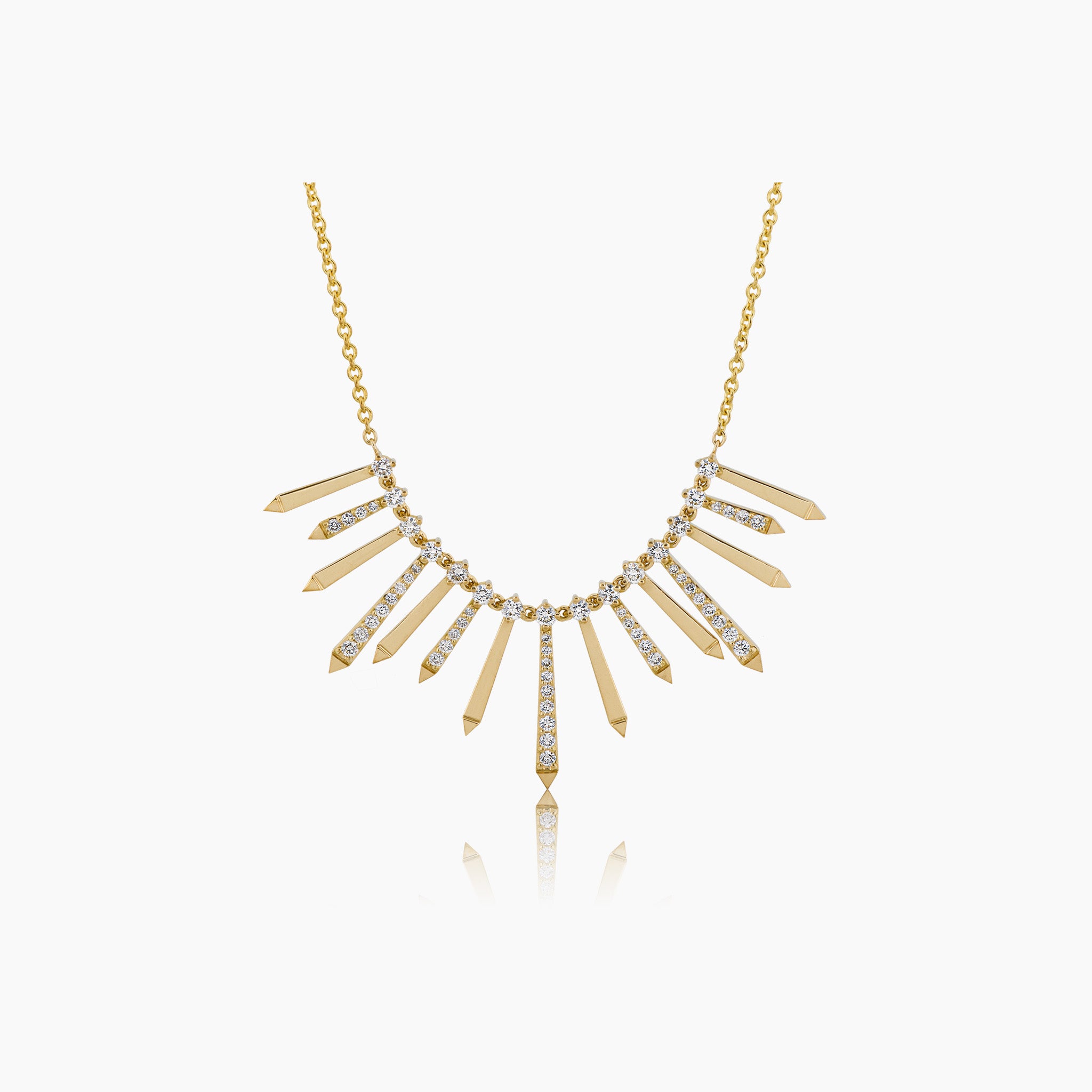 A radiant and sophisticated necklace crafted in gleaming yellow gold, adorned with dazzling diamonds, presented against an off-white background.