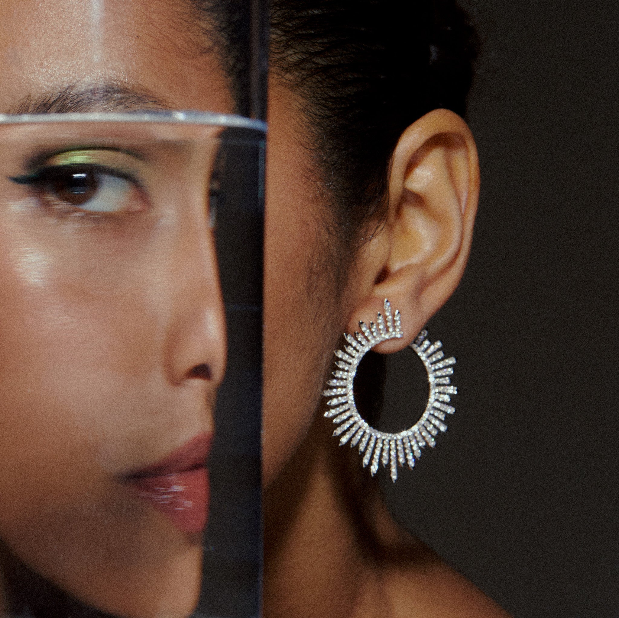 Diamond ray-like earrings, fine jewellery displayed on a model. 